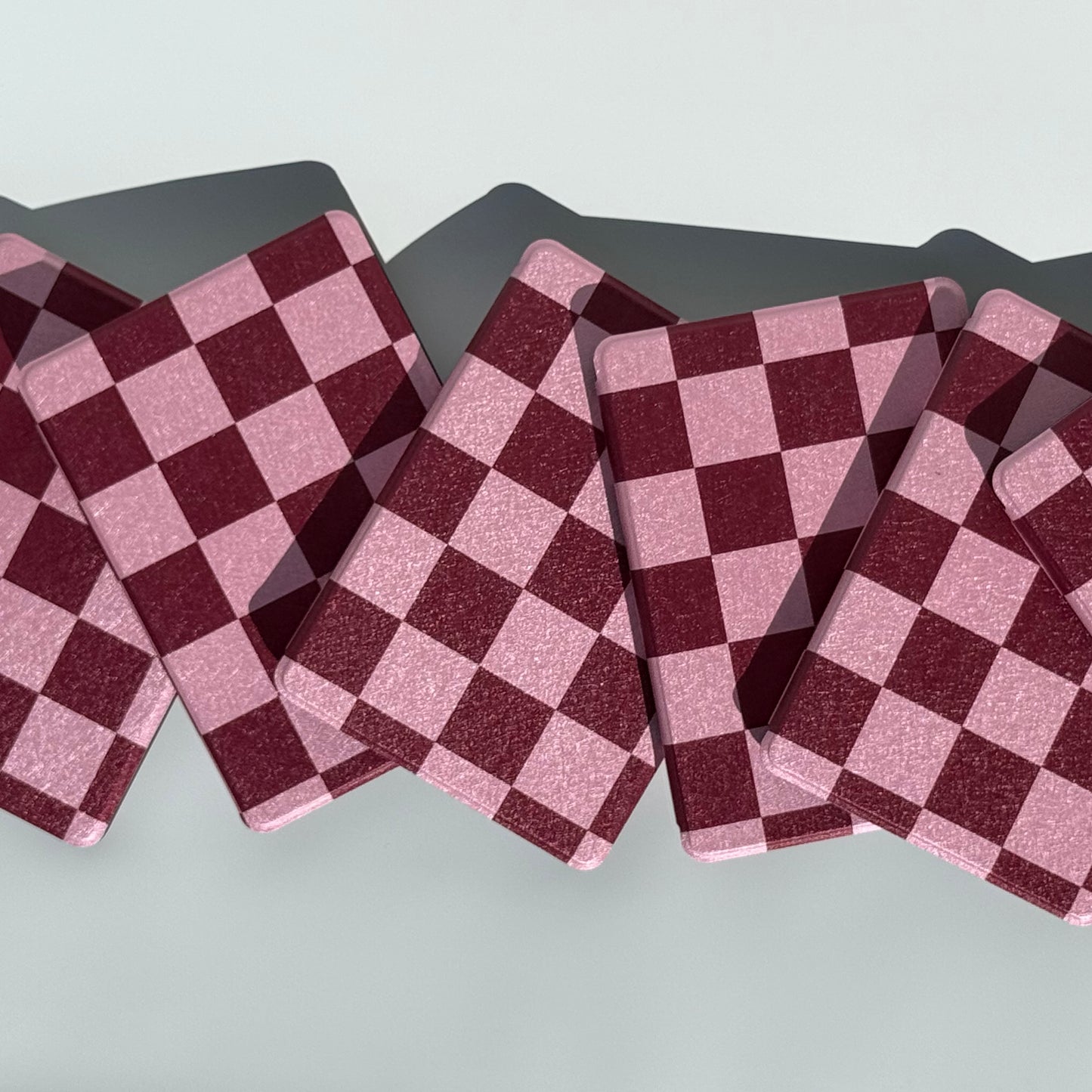 Checkered pattern kindle cover in pink with hand strap