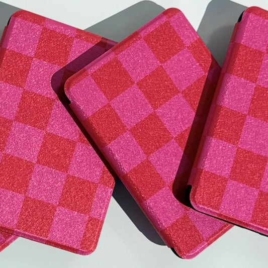 Two pink and red checkered Love's Bouquet Kindle cases overlapping showing checkerboard pattern detail