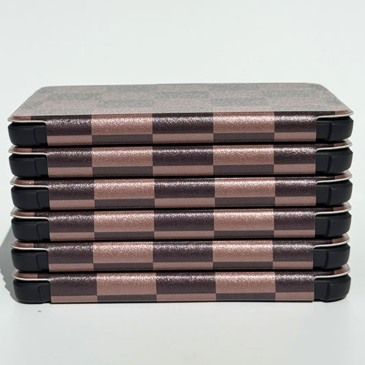 Side profile of The Dreamer Kobo Libra cases stacked, mocha checkerboard pattern with shockproof bumper