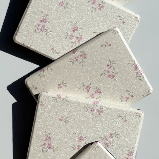 Blooming ditsy floral Kindle cases at an angle, rose-pink blossoms on pearly ivory, Case Society Co