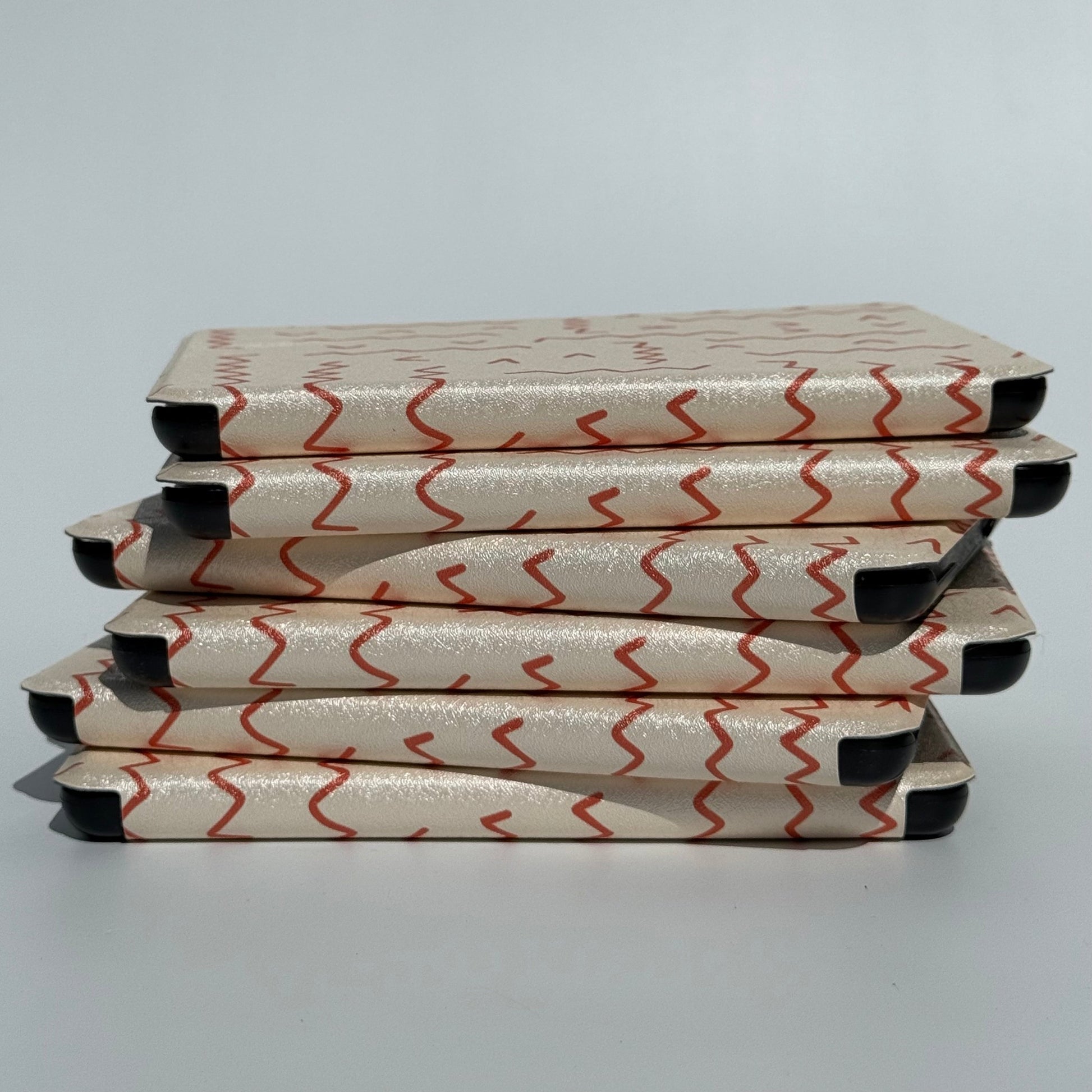 Between The Lines red squiggle Kindle case with hand strap