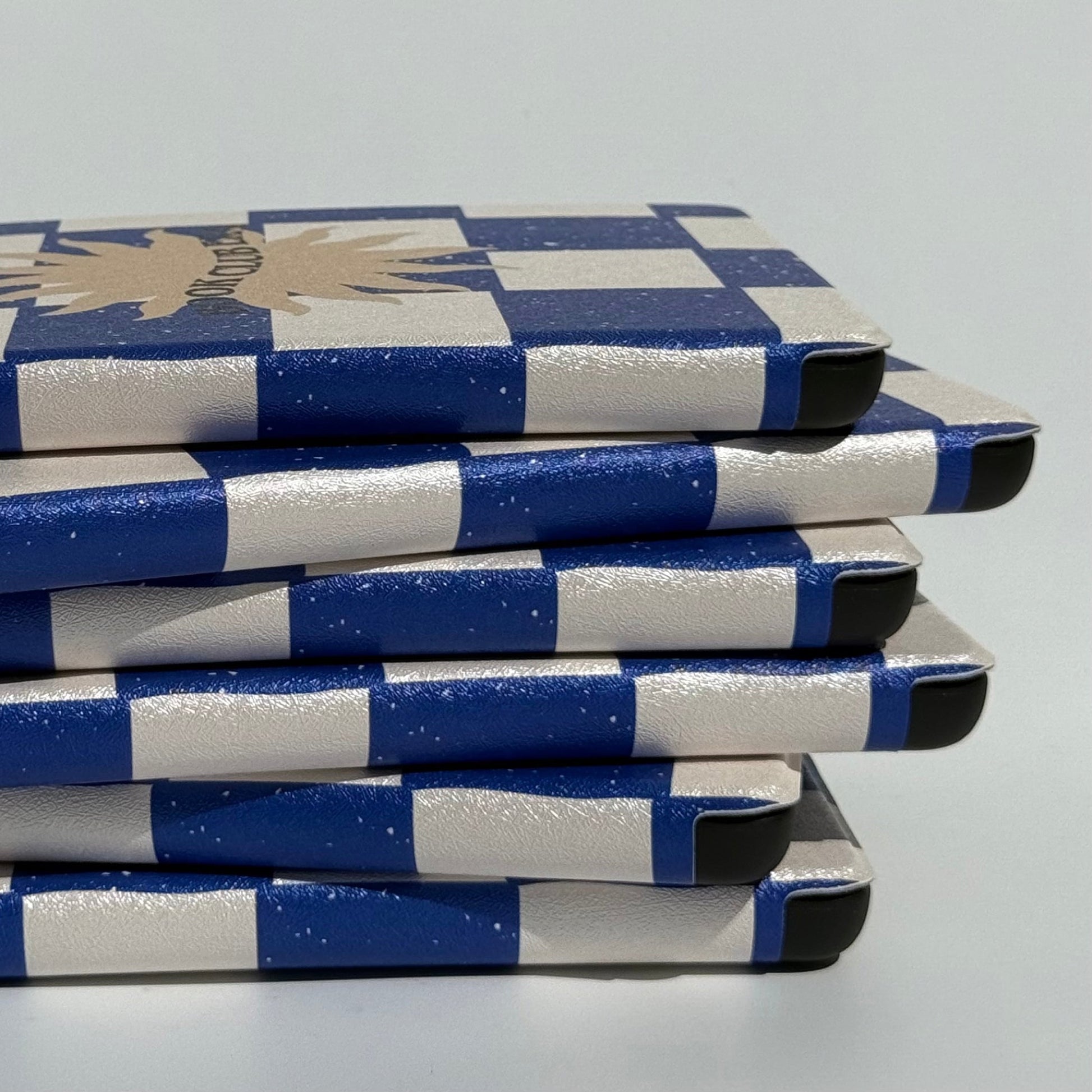 Side group of Book Club Era navy check Kindle cases