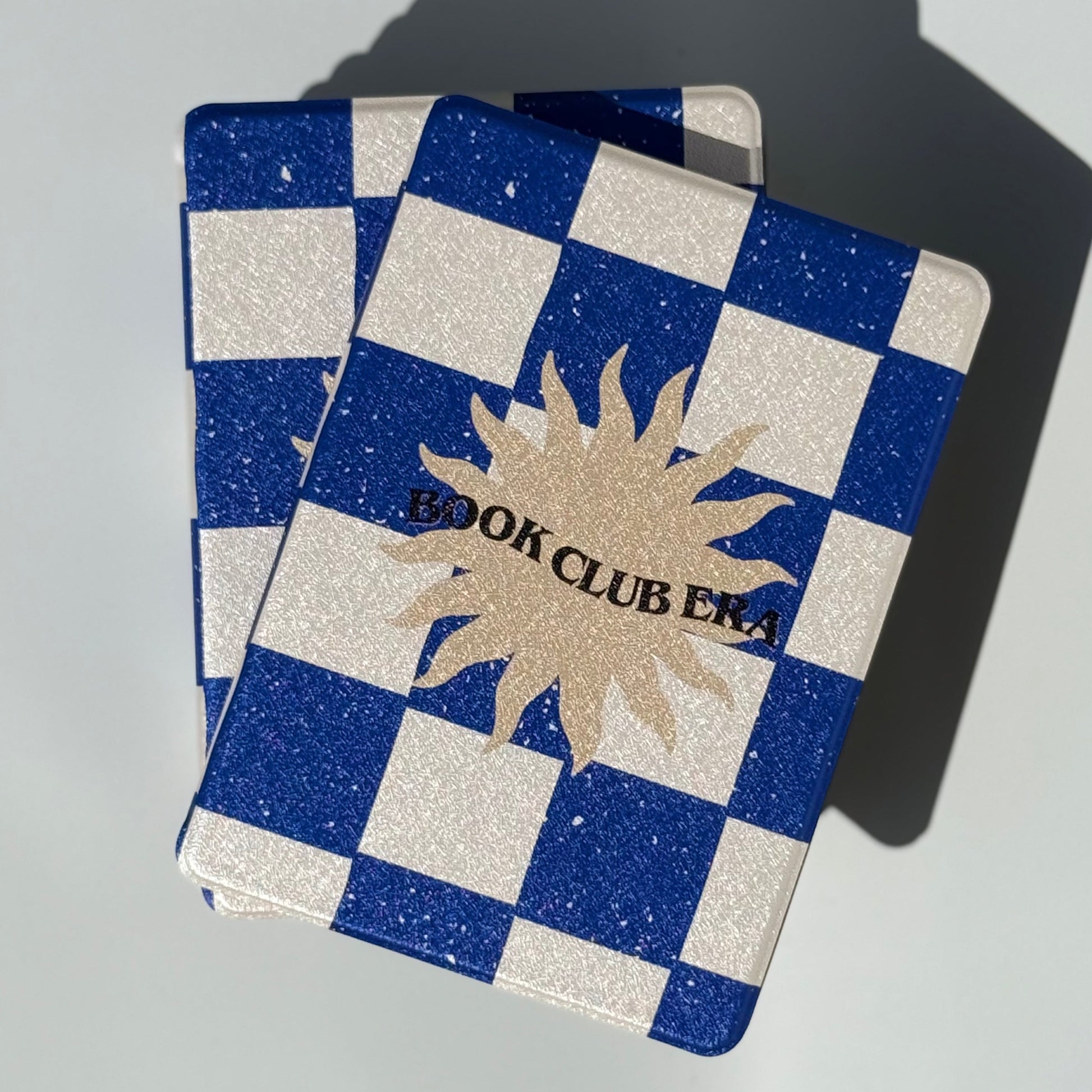 Book Club Era Kindle case in navy checkerboard with hand strap