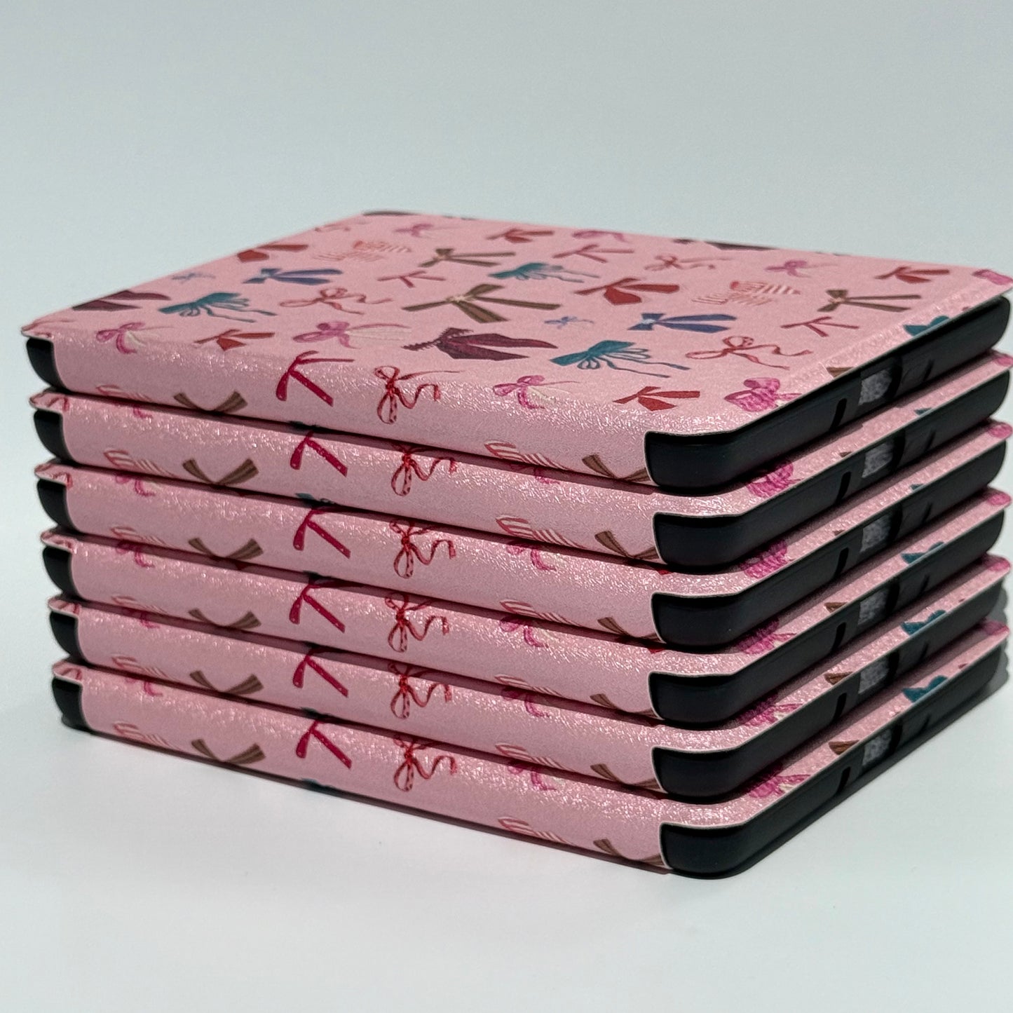 bound in bows kindle case Australia stacked in pile