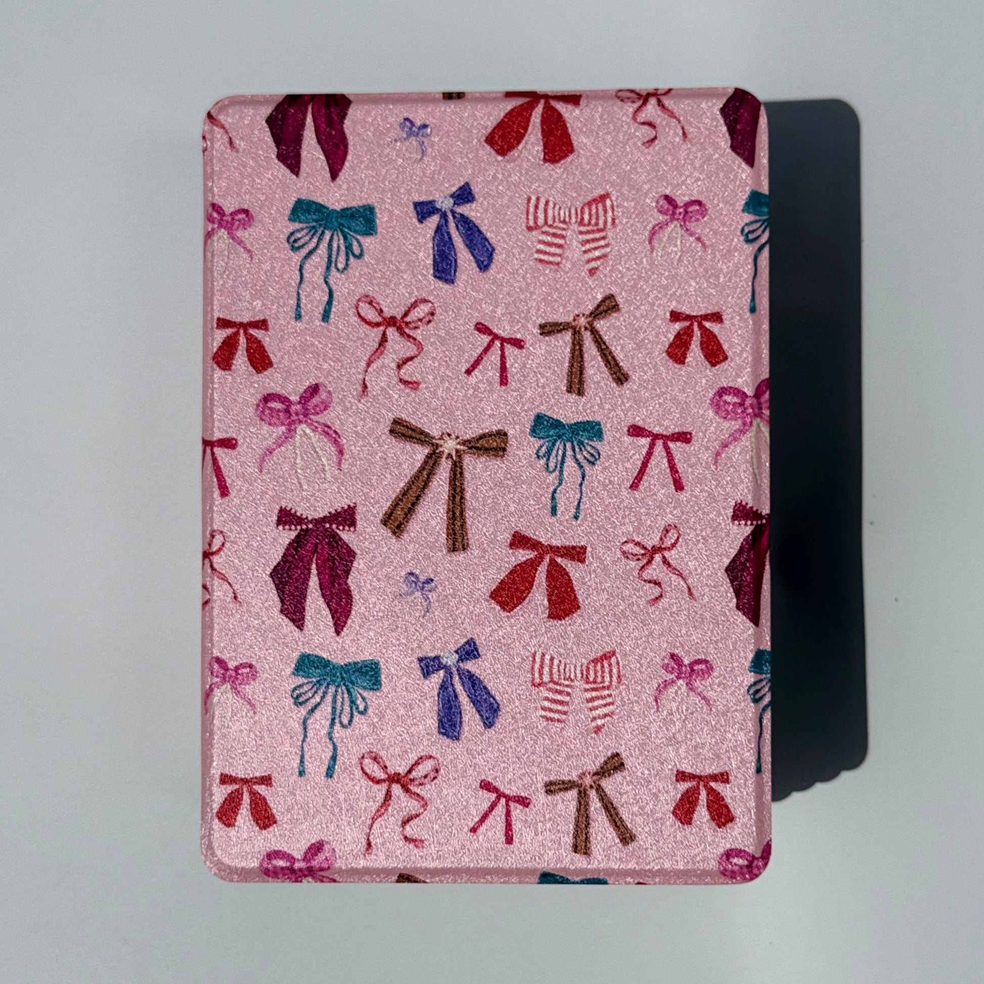 cute pink kindle case with a bow pattern design on white background