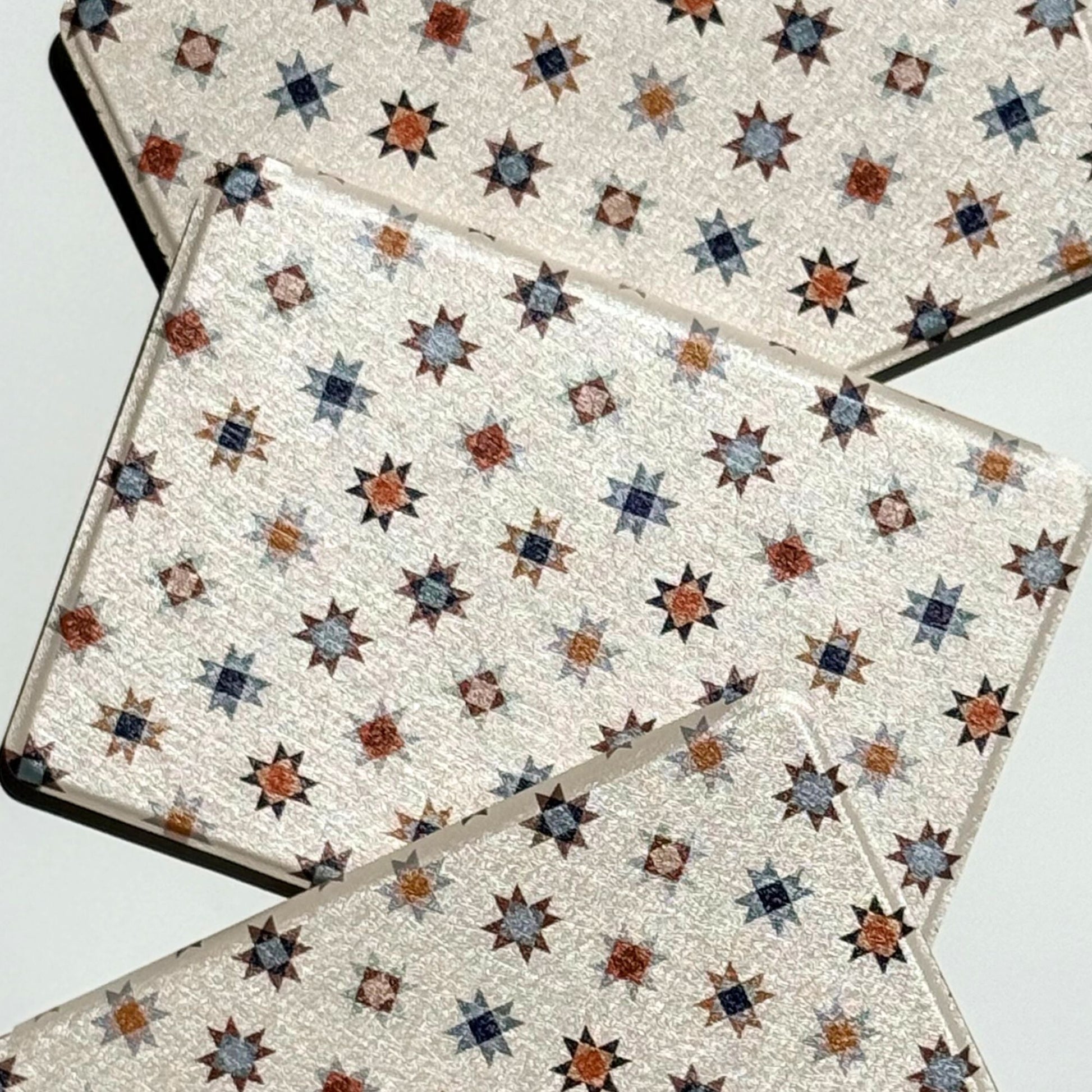 Everloom Kindle case, cream folk quilt-star print in navy and rust — aesthetic cottagecore Kindle cover