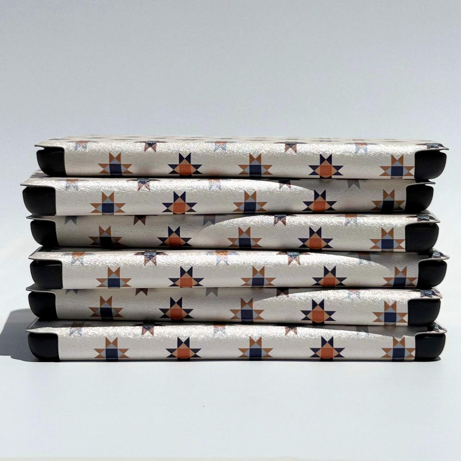 Side view of the Everloom folk quilt-star Kindle case