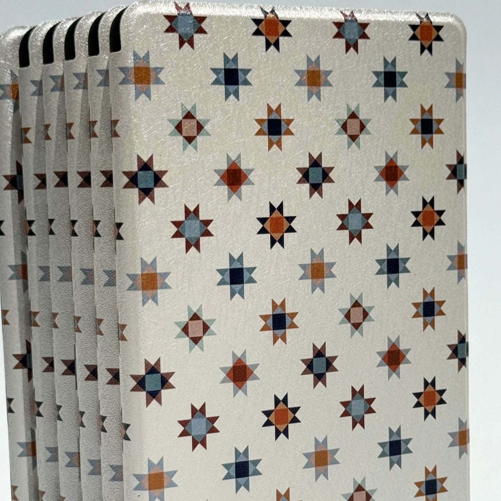 Everloom folk star Kindle case standing, navy and rust on cream