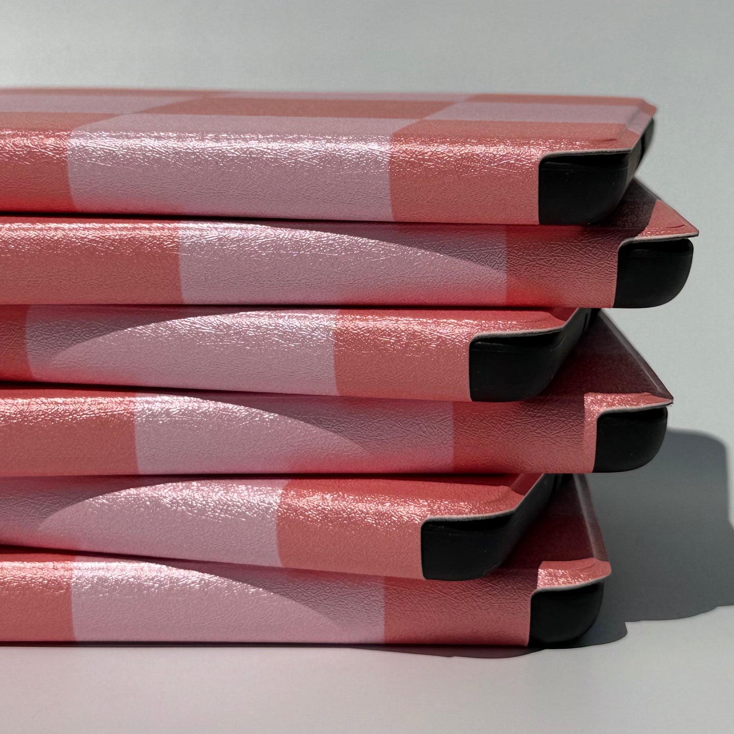 Fairy Tales Kindle Case - Up close spine view of uneven stack of cases