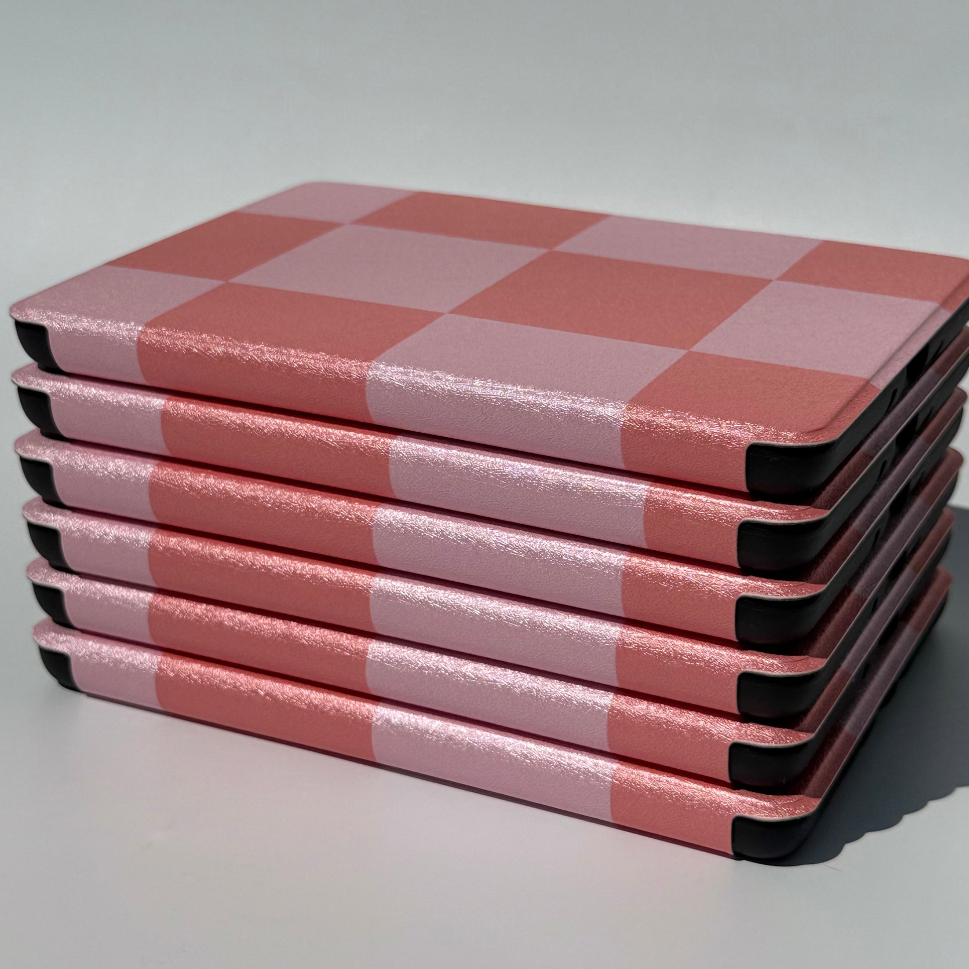 Fairy Tales Kindle Case - view of spine and base of stack of cases 