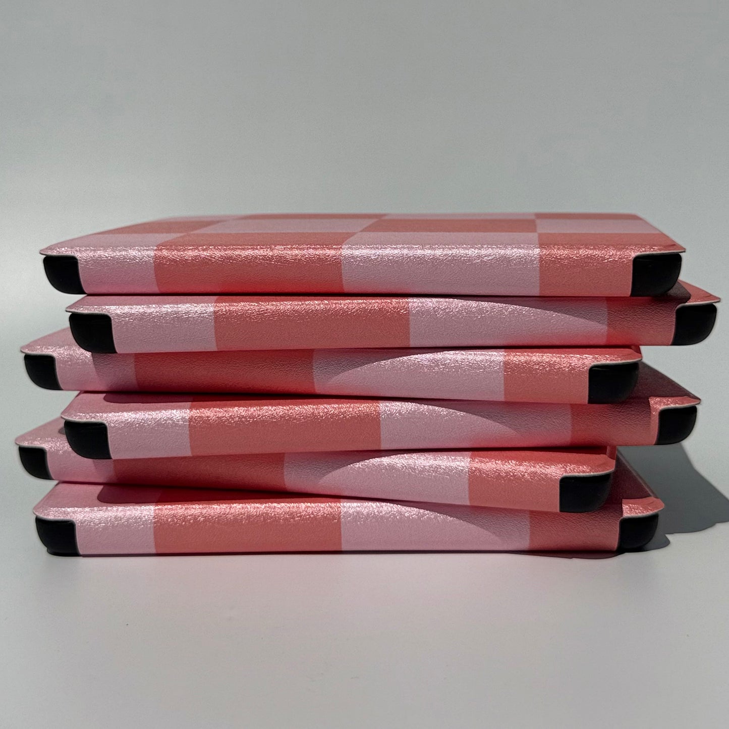 Fairy Tales Kindle Case - side view of uneven stack of cases