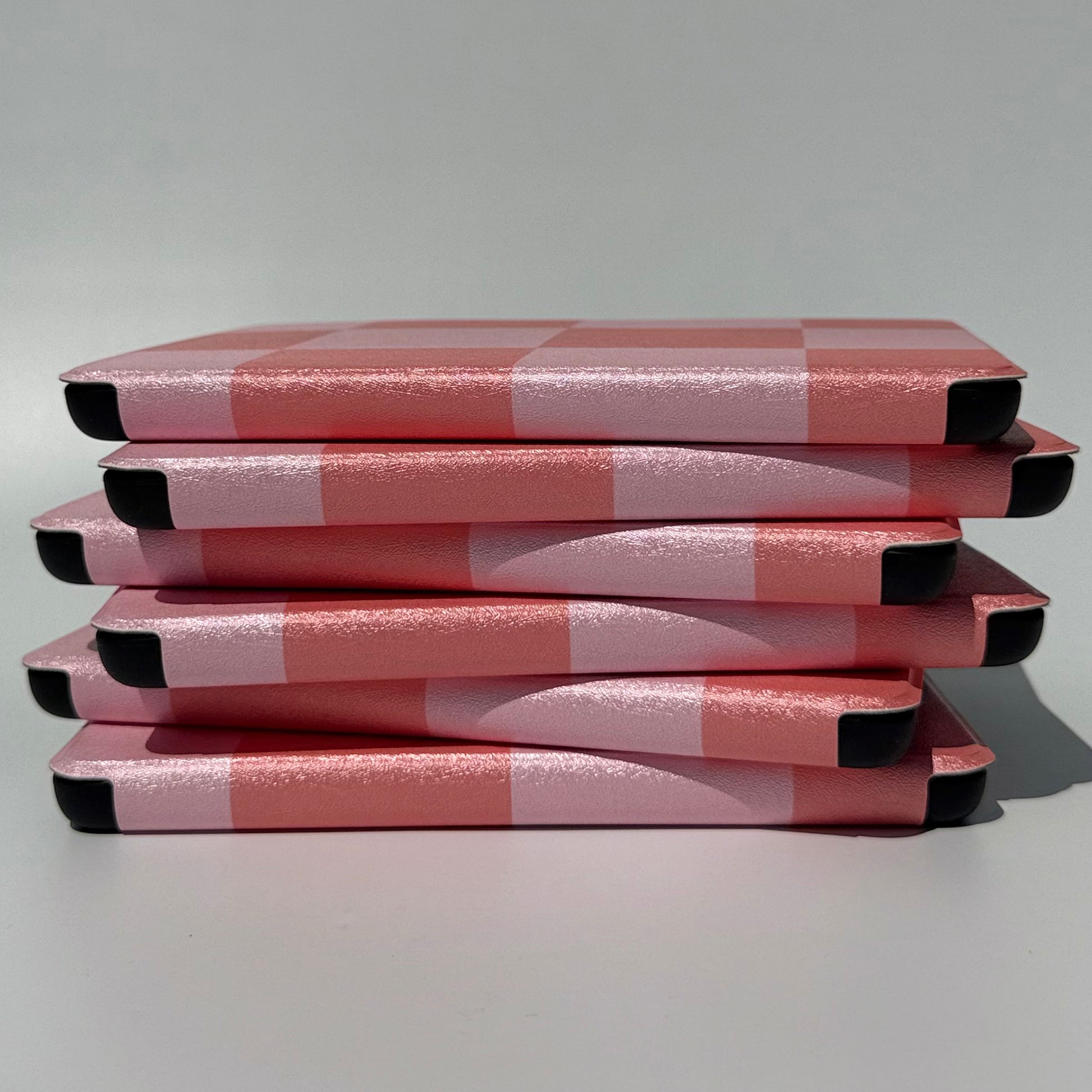 Fairy Tales Kindle Case - side view of uneven stack of cases