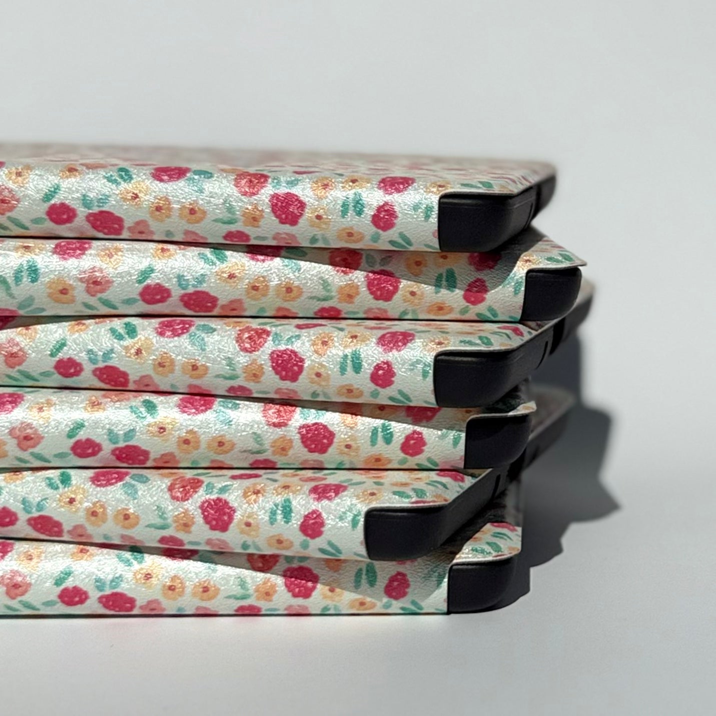 Side view of floral kindle cases with handstrap
