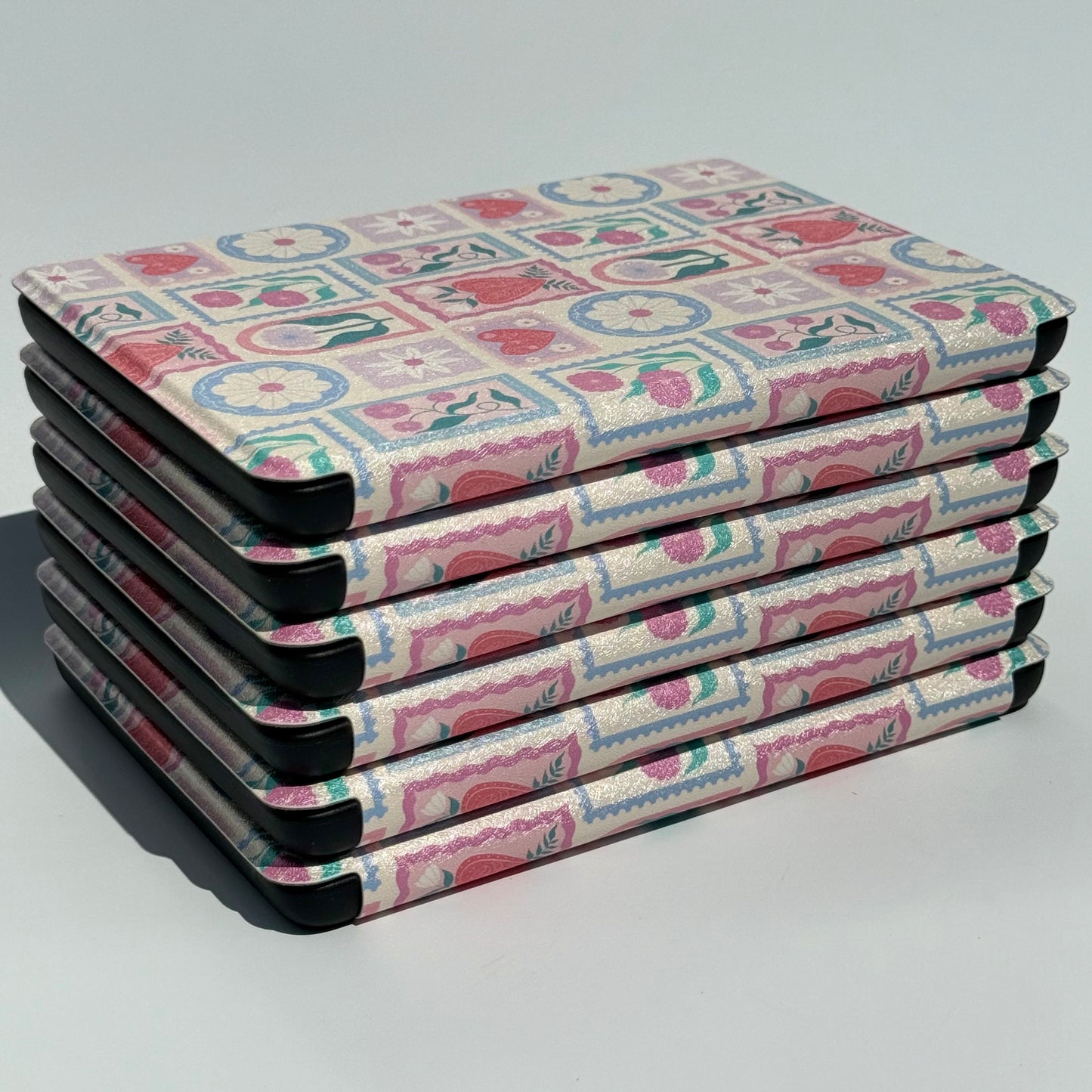 stack of cute kindle cases with floral pattern