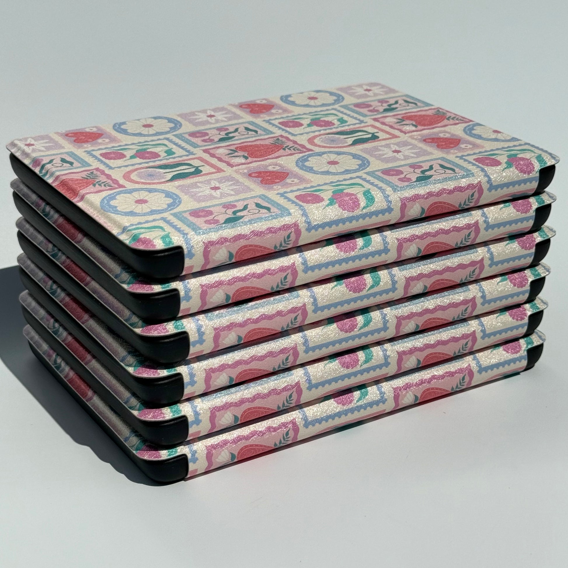 stack of cute kindle cases with floral pattern