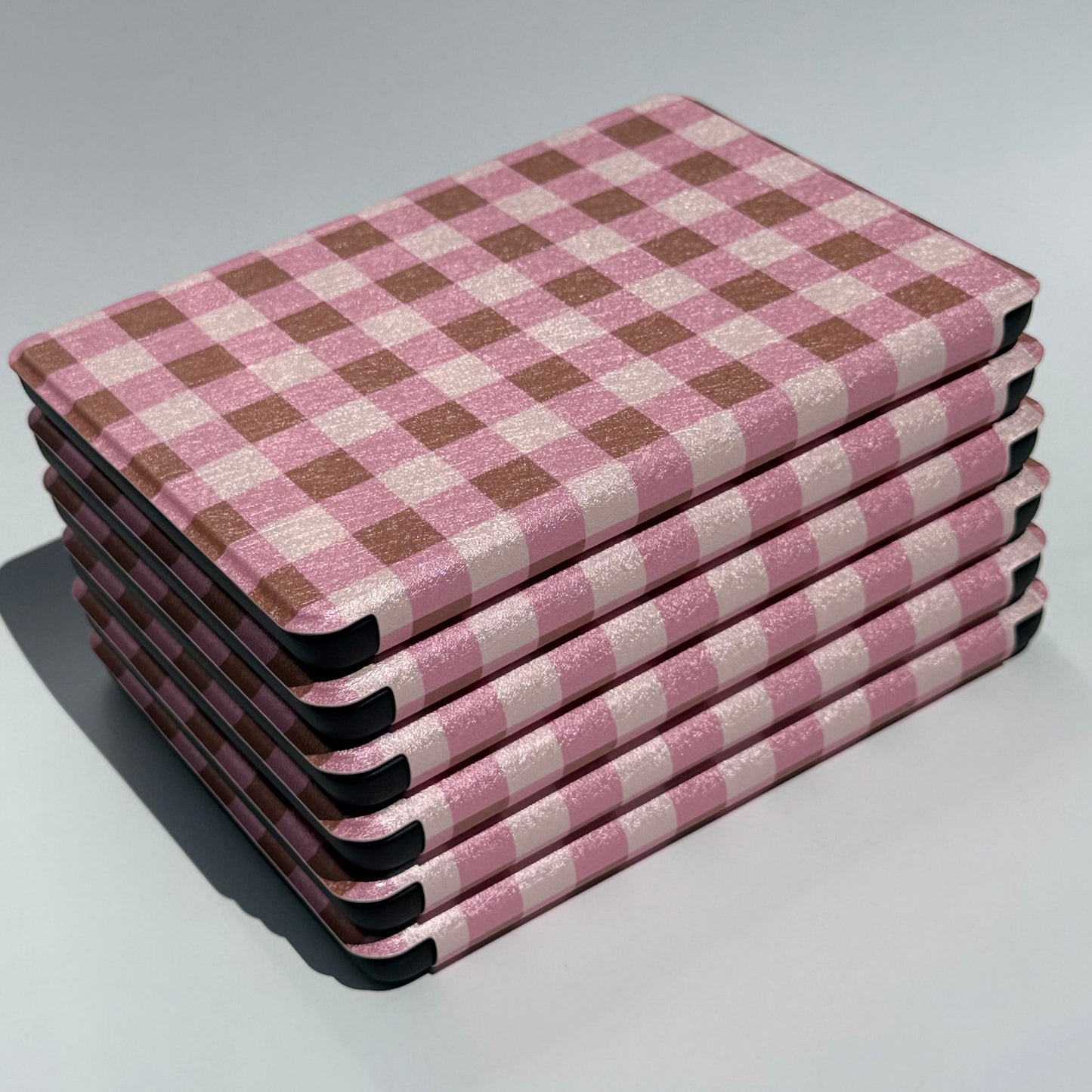 Pink and brown checkered lightweight kindle sleeve with hand strap