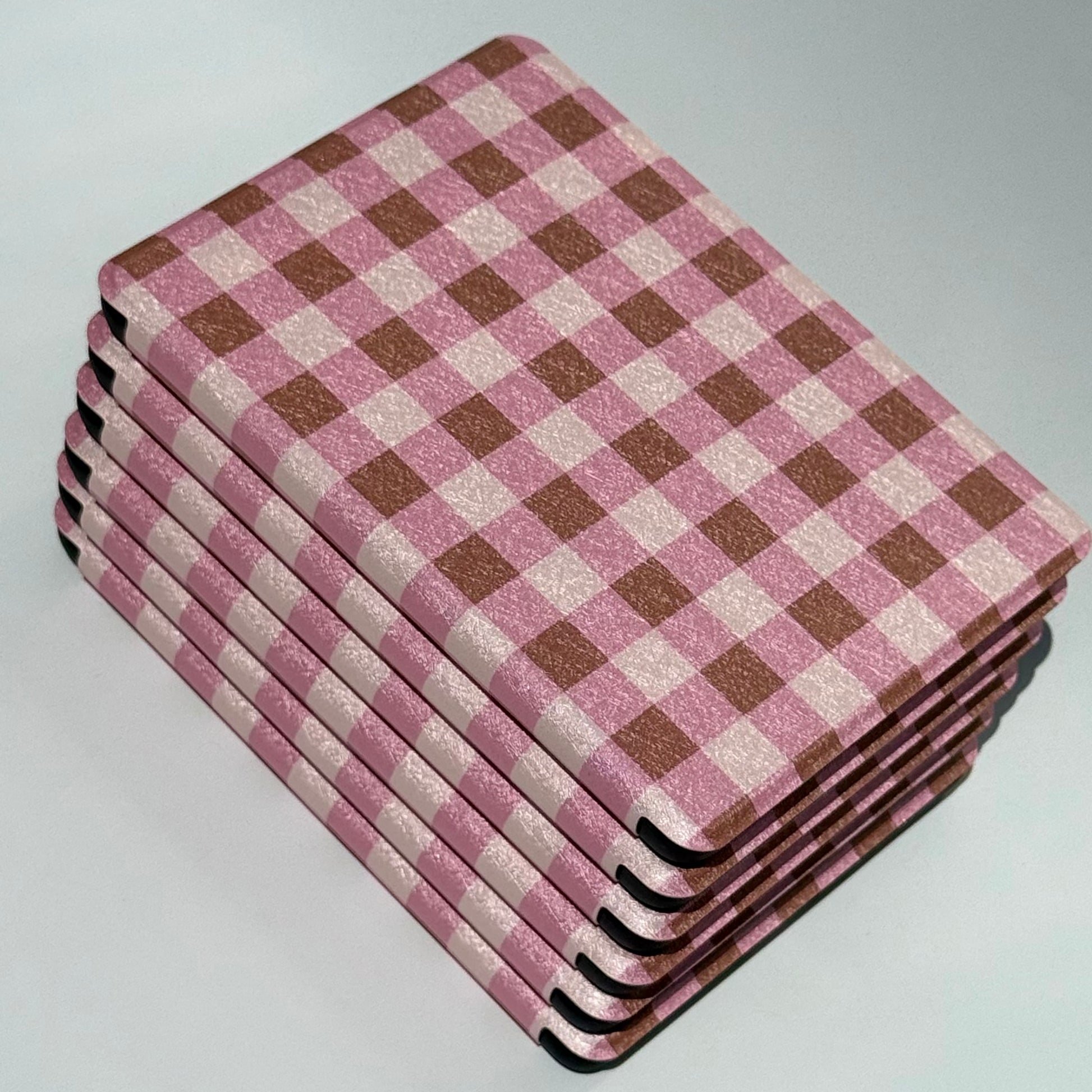 Pink checkered kindle cover with shockproof design and hand strap