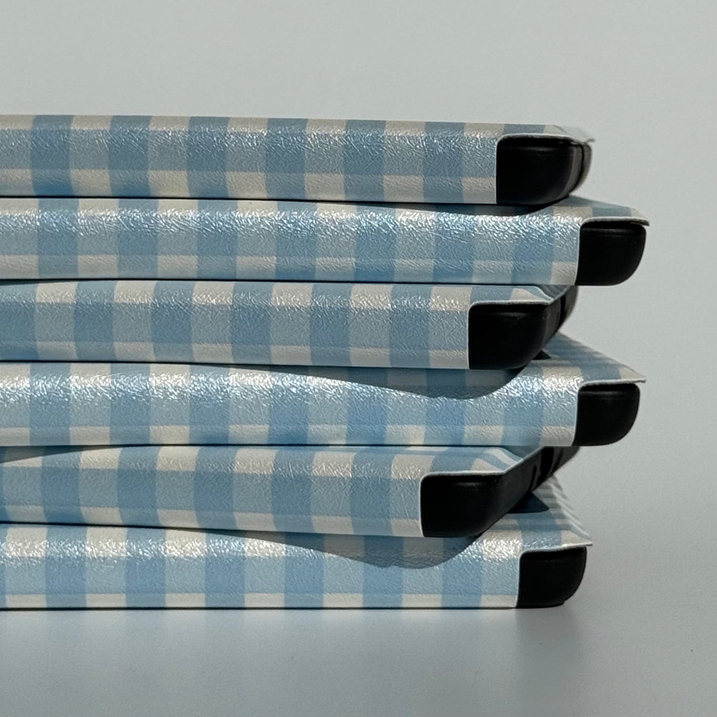 Side view of The Quiet Blue blue gingham Kindle case with auto sleep/wake
