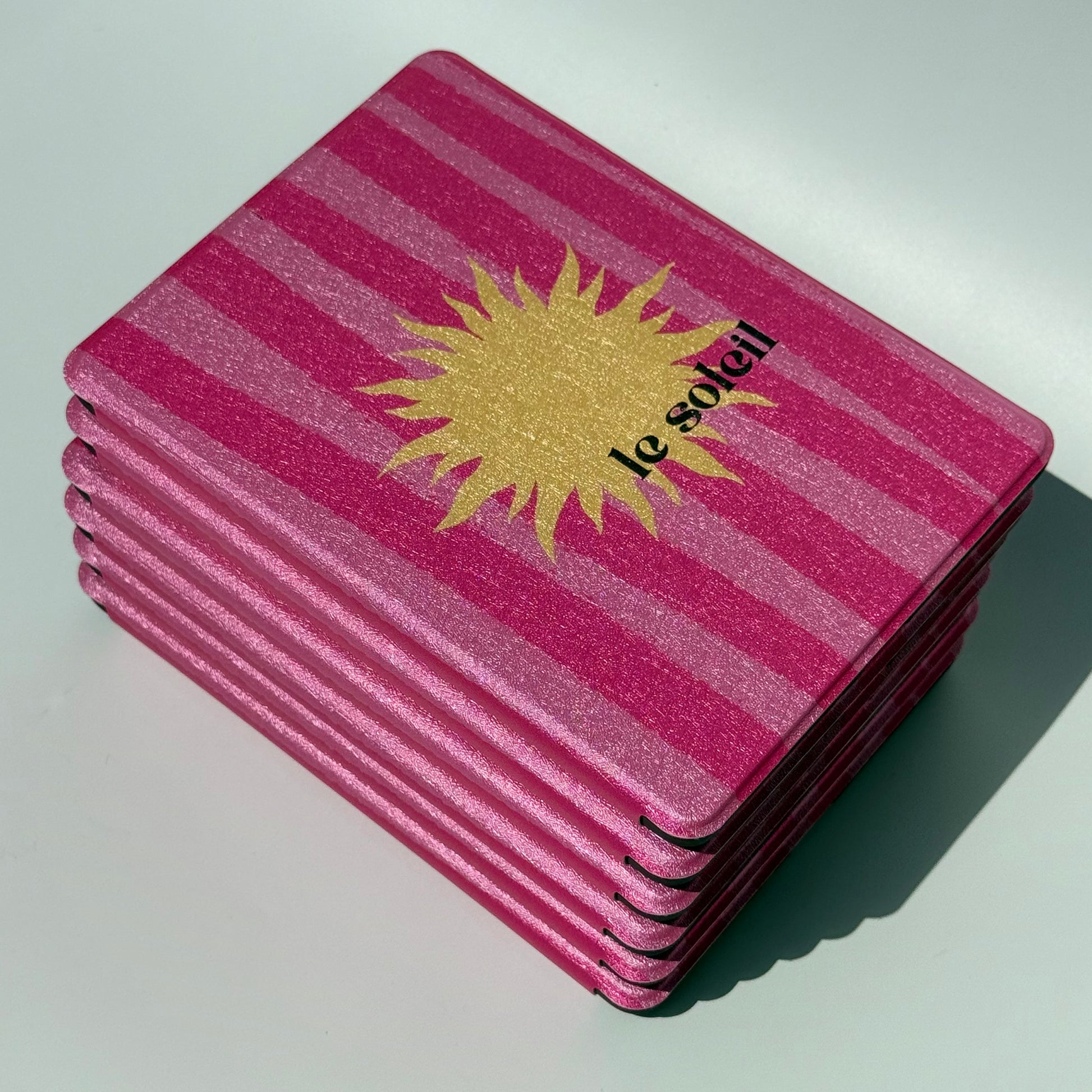 Le Soleil Kindle Case - view from above of stack of cases