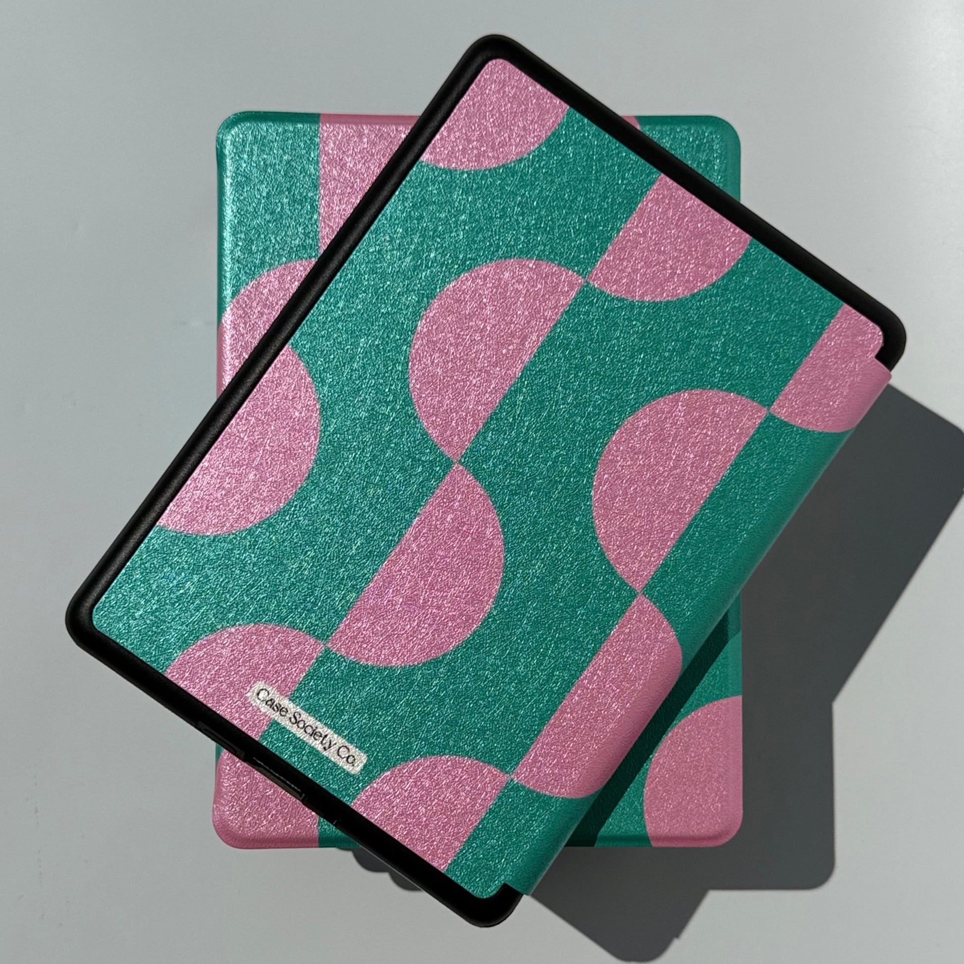 Top view of the Pink Crescent green and pink geometric Kindle case