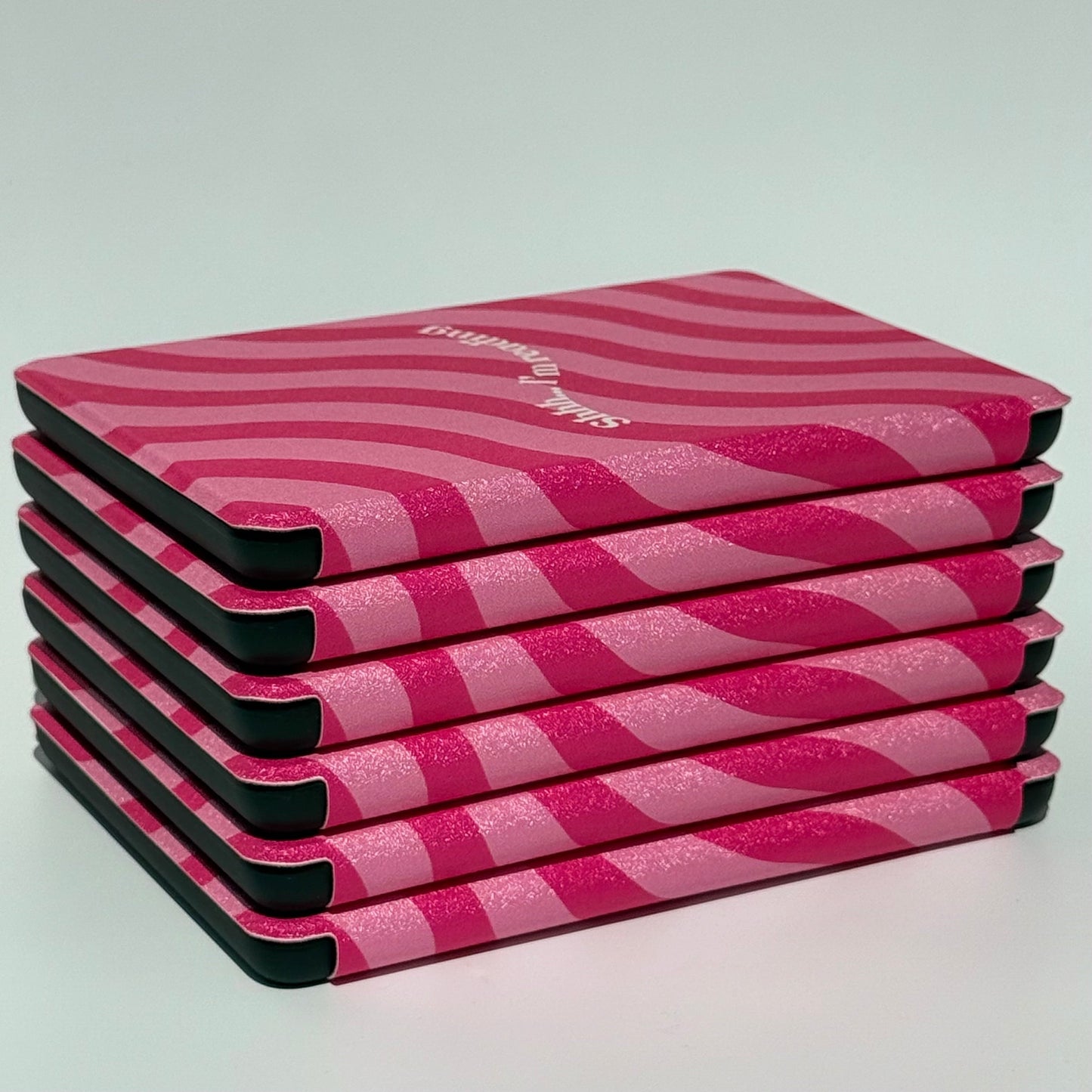 Side view of the Shhh I'm Reading pink wavy Kindle case with auto sleep/wake