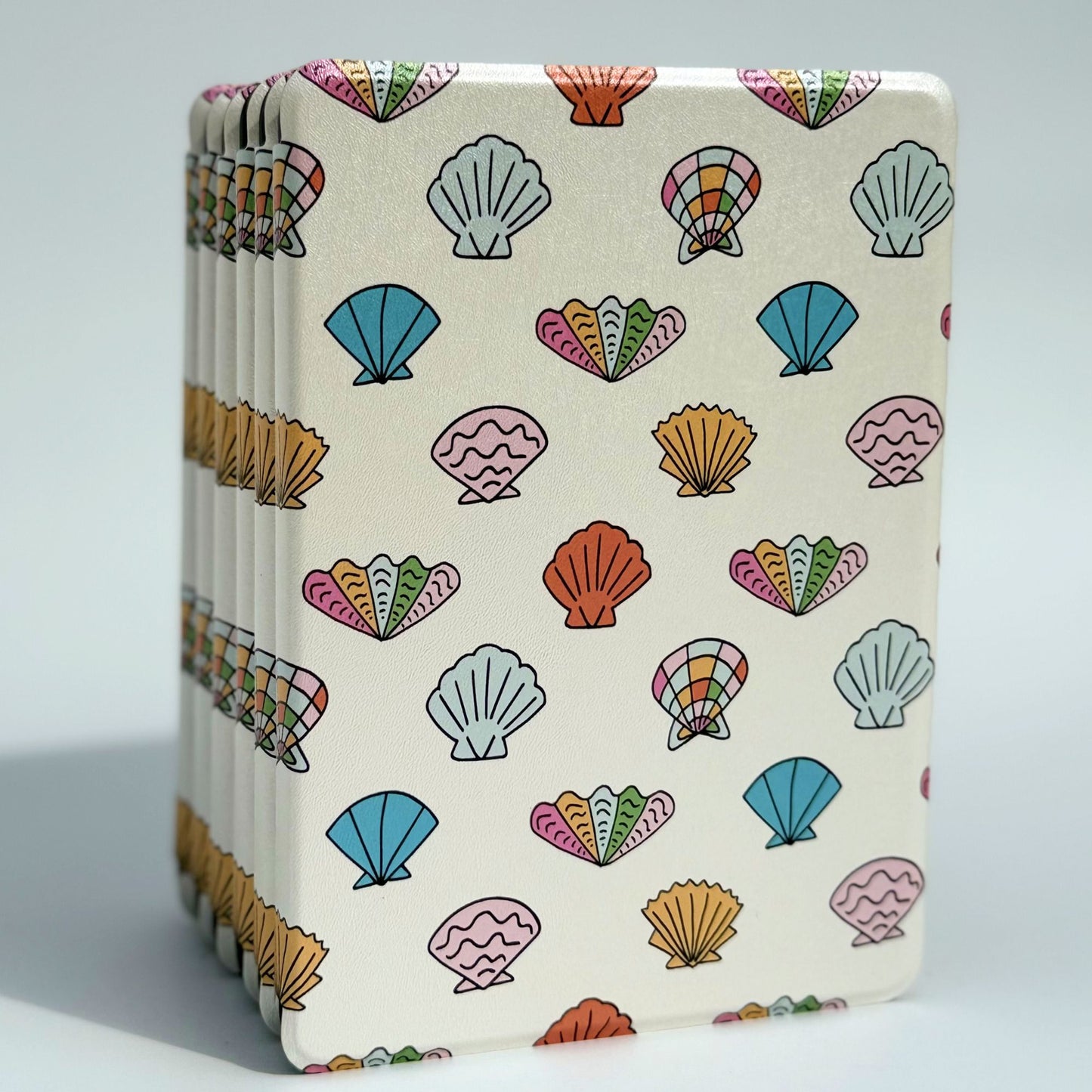Shores Of Ophelia Kindle case, cream coastal seashell print in blue and coral — aesthetic seashell Kindle cover