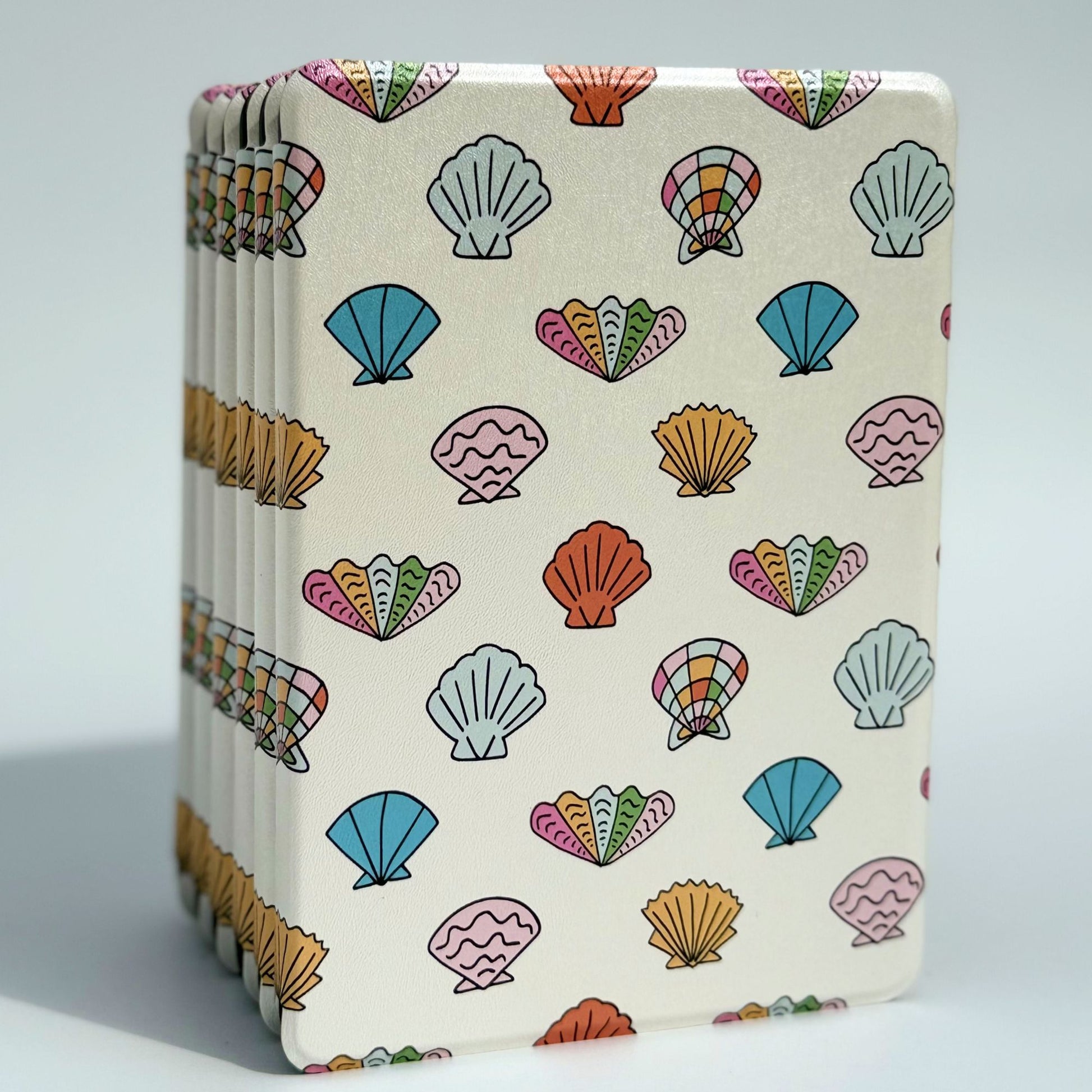 Shores Of Ophelia Kindle case, cream coastal seashell print in blue and coral — aesthetic seashell Kindle cover