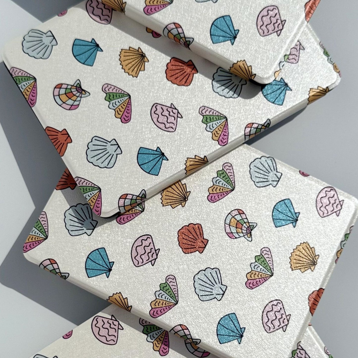 Shores Of Ophelia coastal seashell Kindle case, front view