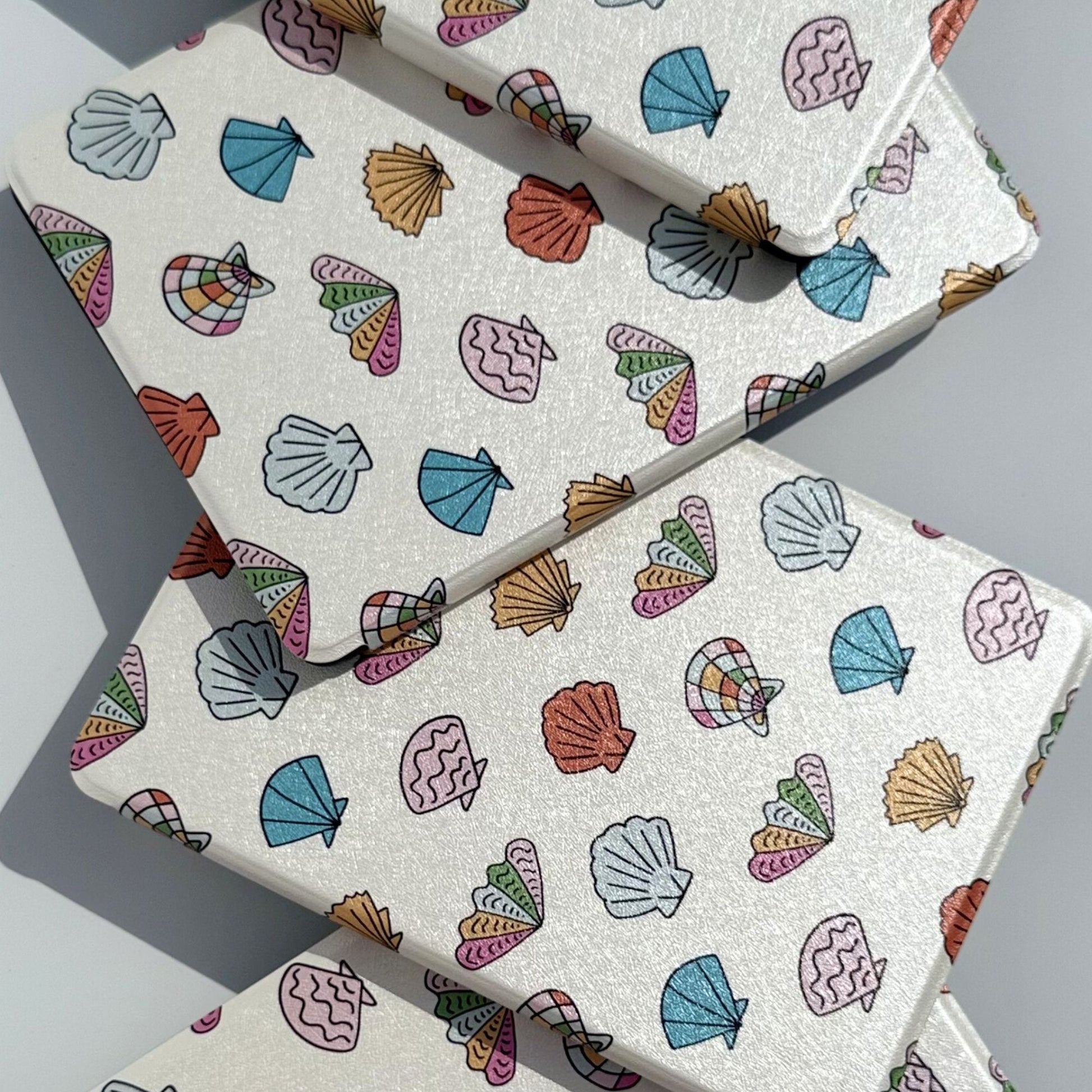 Shores Of Ophelia coastal seashell Kindle case, front view