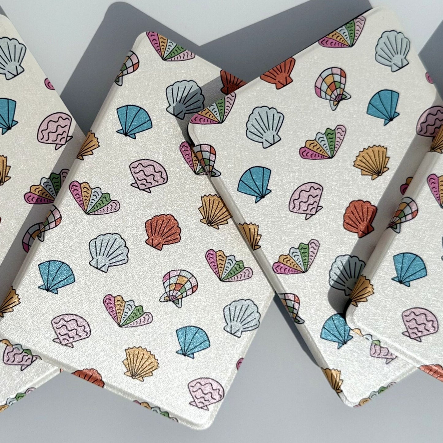 Group of Shores Of Ophelia coastal seashell Kindle cases