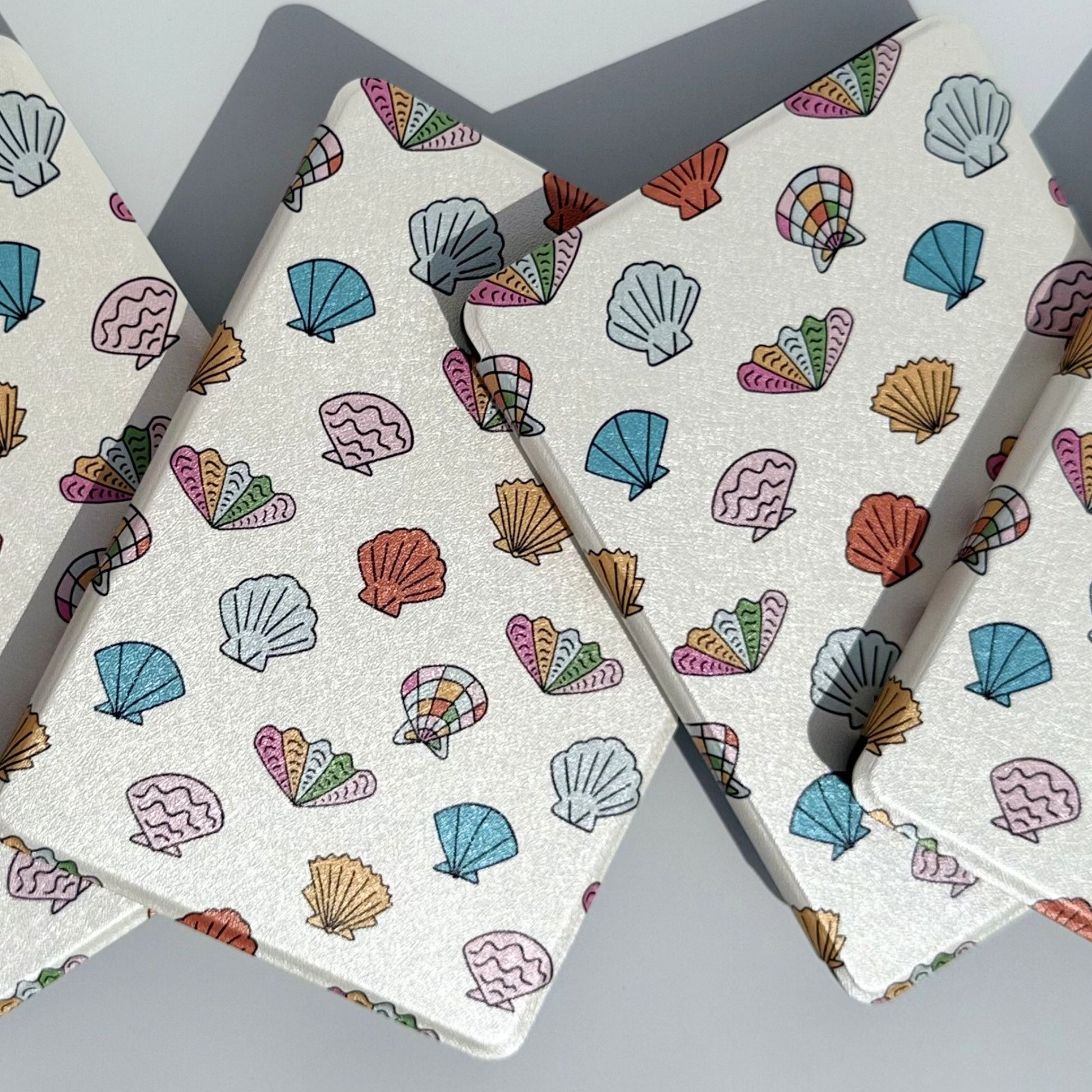 Group of Shores Of Ophelia coastal seashell Kindle cases