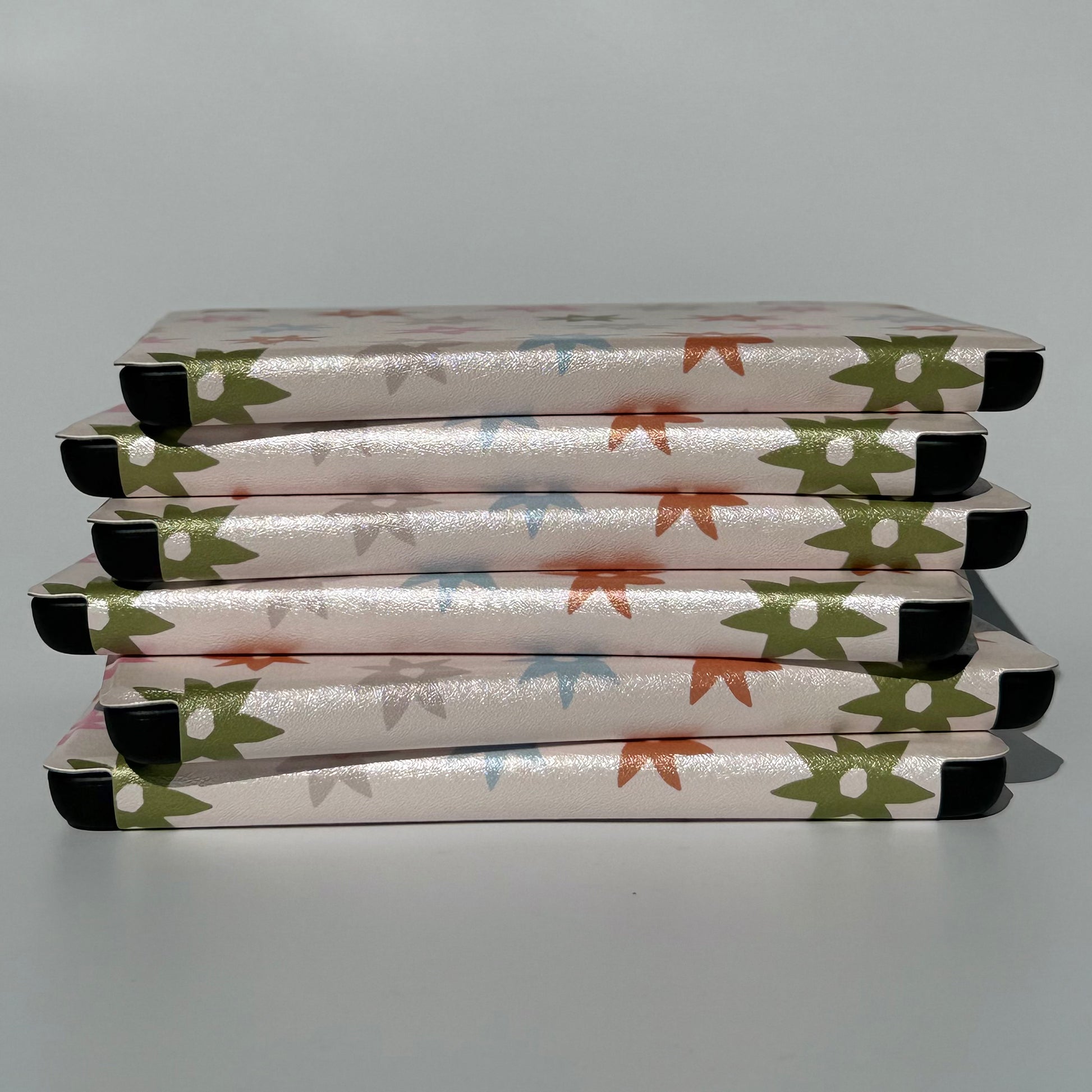 Pastel Floral kindle cases stacked 