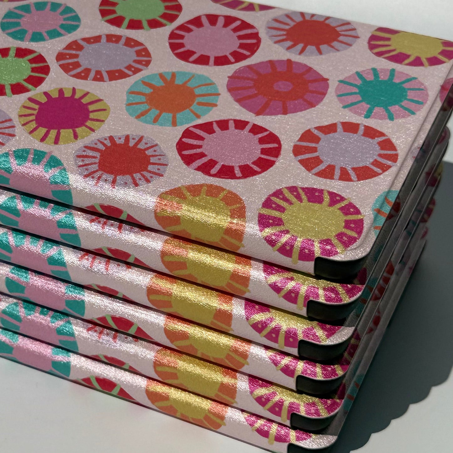 Sun Kissed Kindle Case - up close of stack of cases