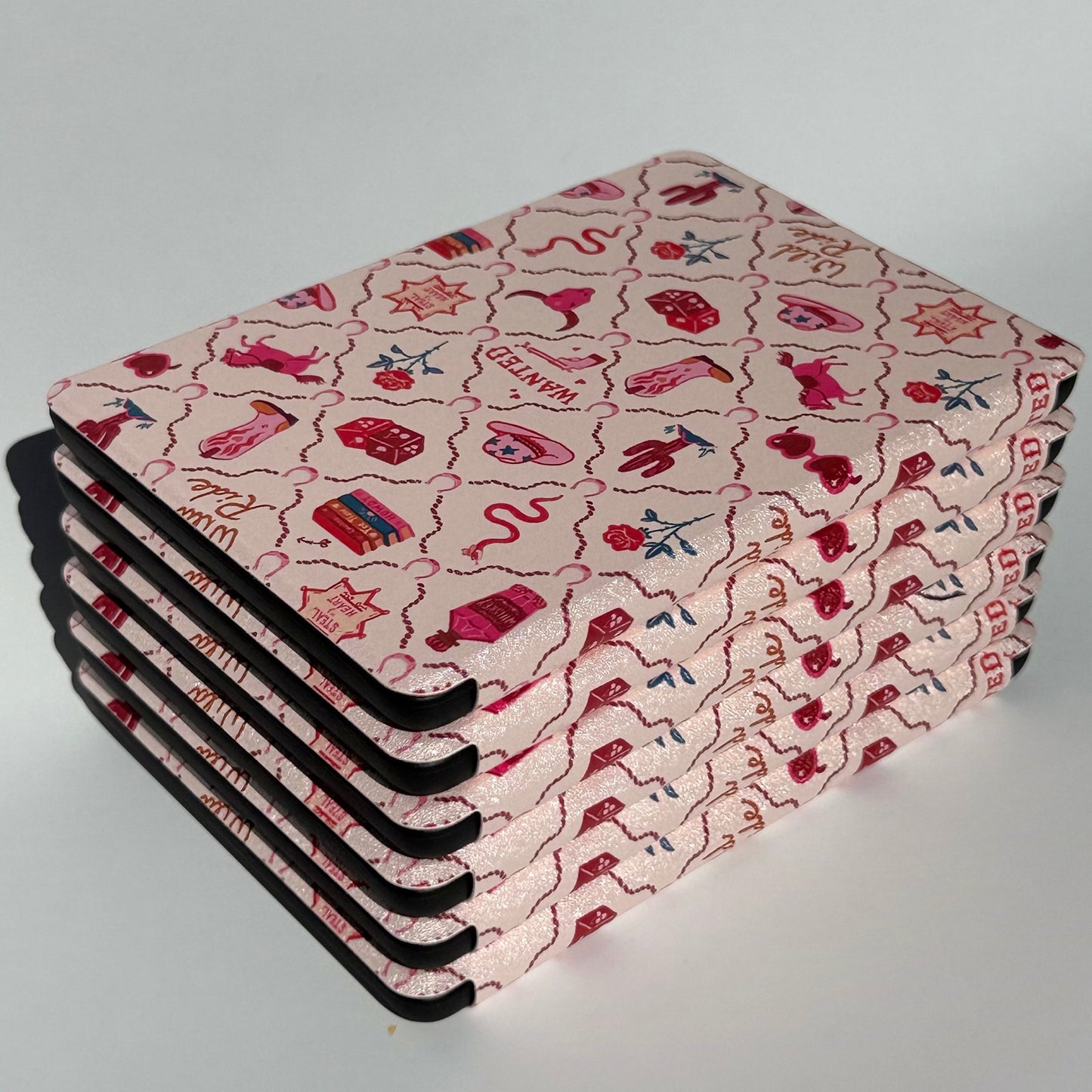 Wild Ride pink western Kindle cases with cowboy hats, boots and roses