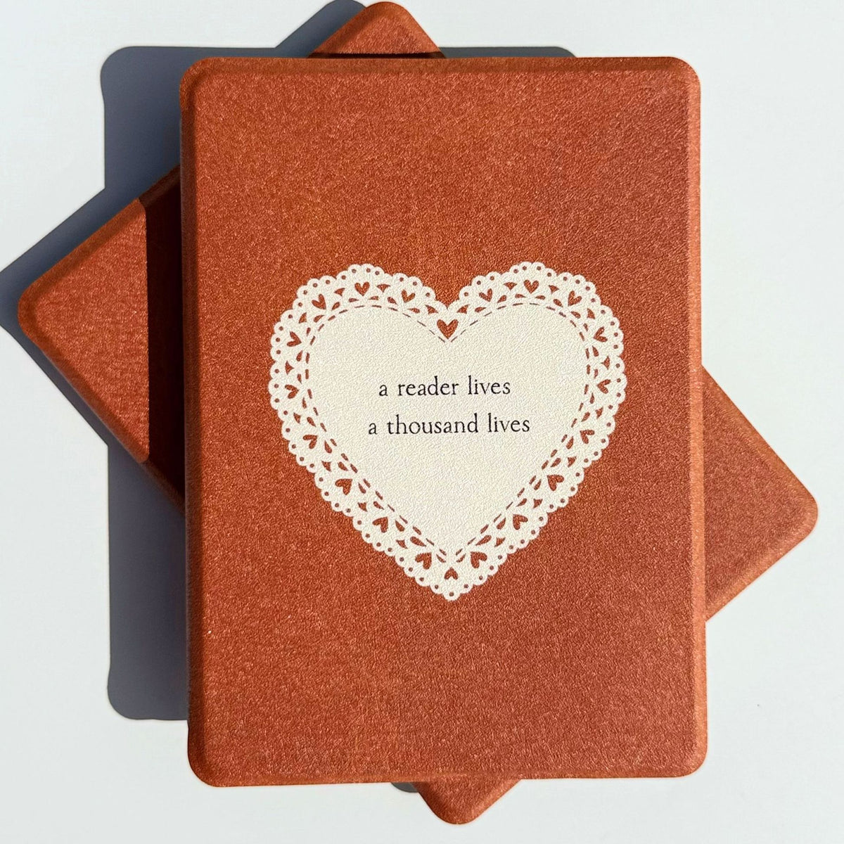 Tan brown Kindle case with a lace heart reading a reader lives a thousand lives, Australia