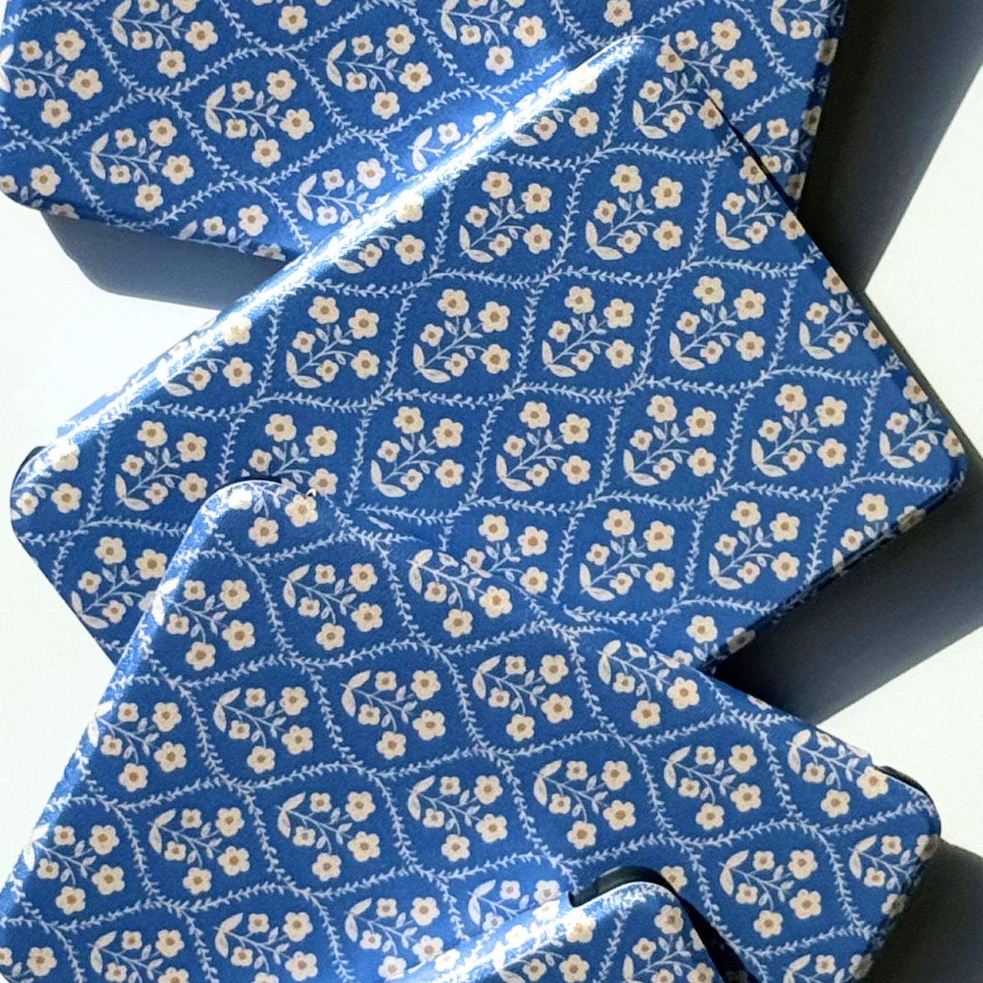 Blue ditsy floral Kobo cases in a flatlay, shipped from Australia