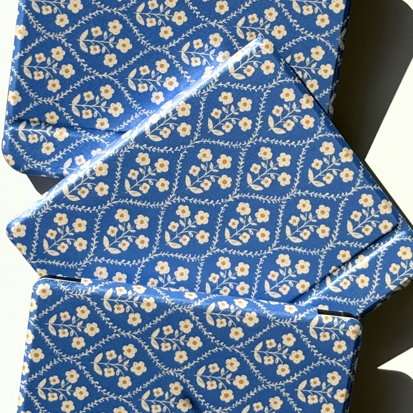 Blue floral Kobo cases arranged in a soft flatlay