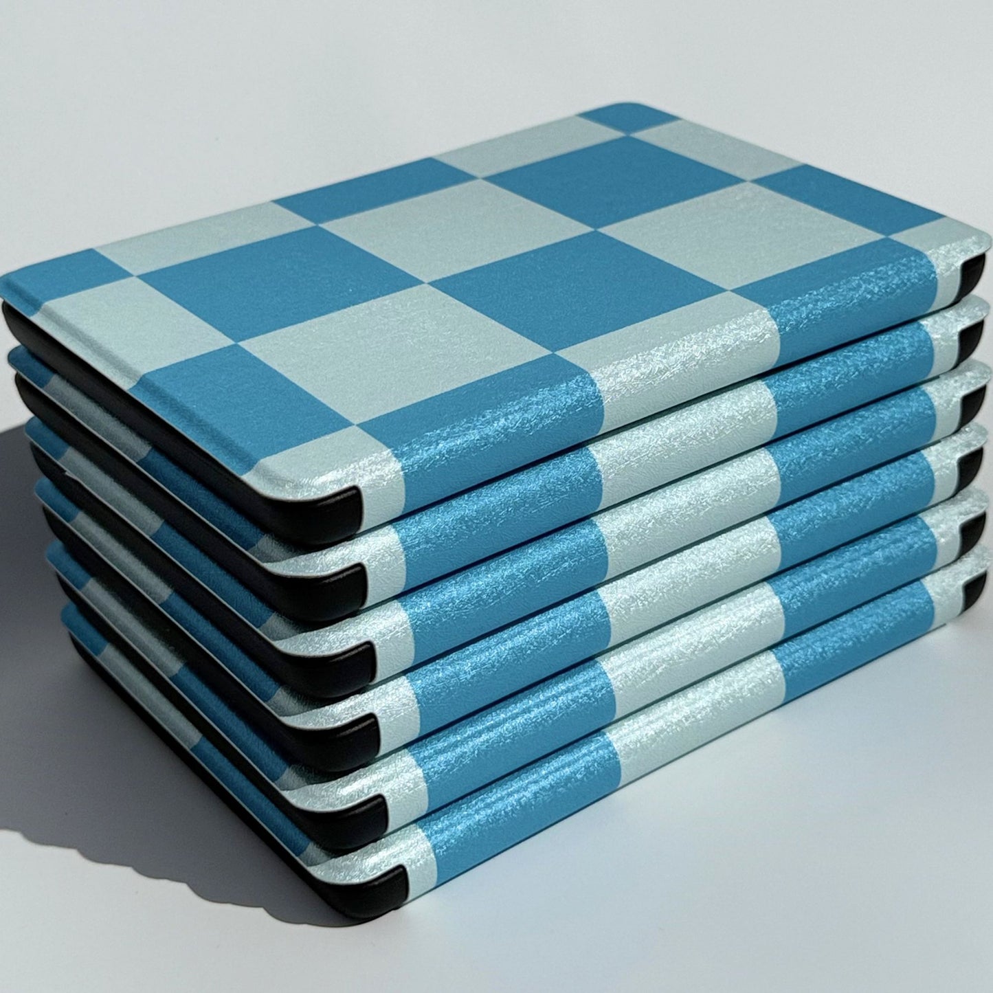Stacked blue gingham Kindle cases, Case Society Co Australia