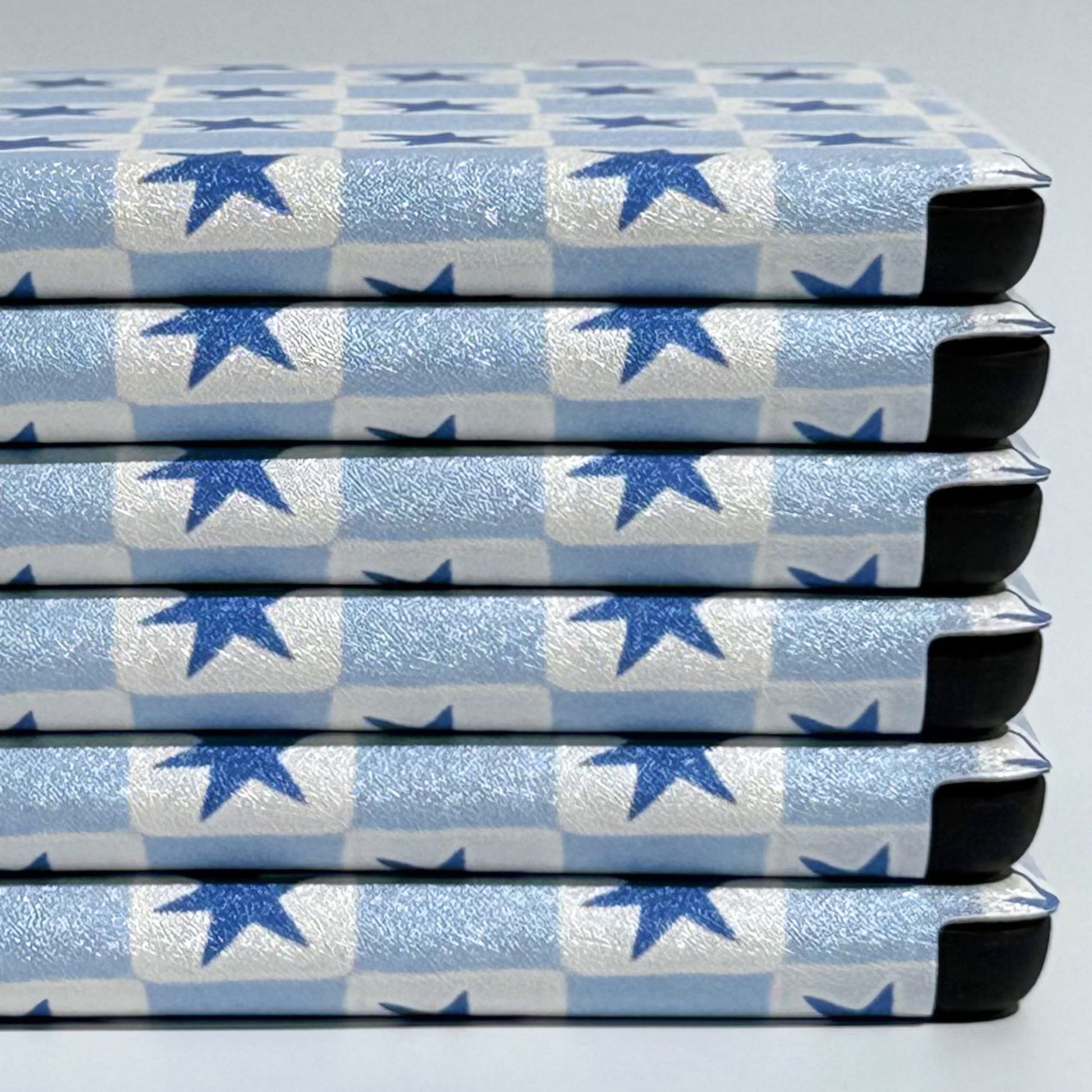 Blue star check Kobo Clara cases stacked on their sides