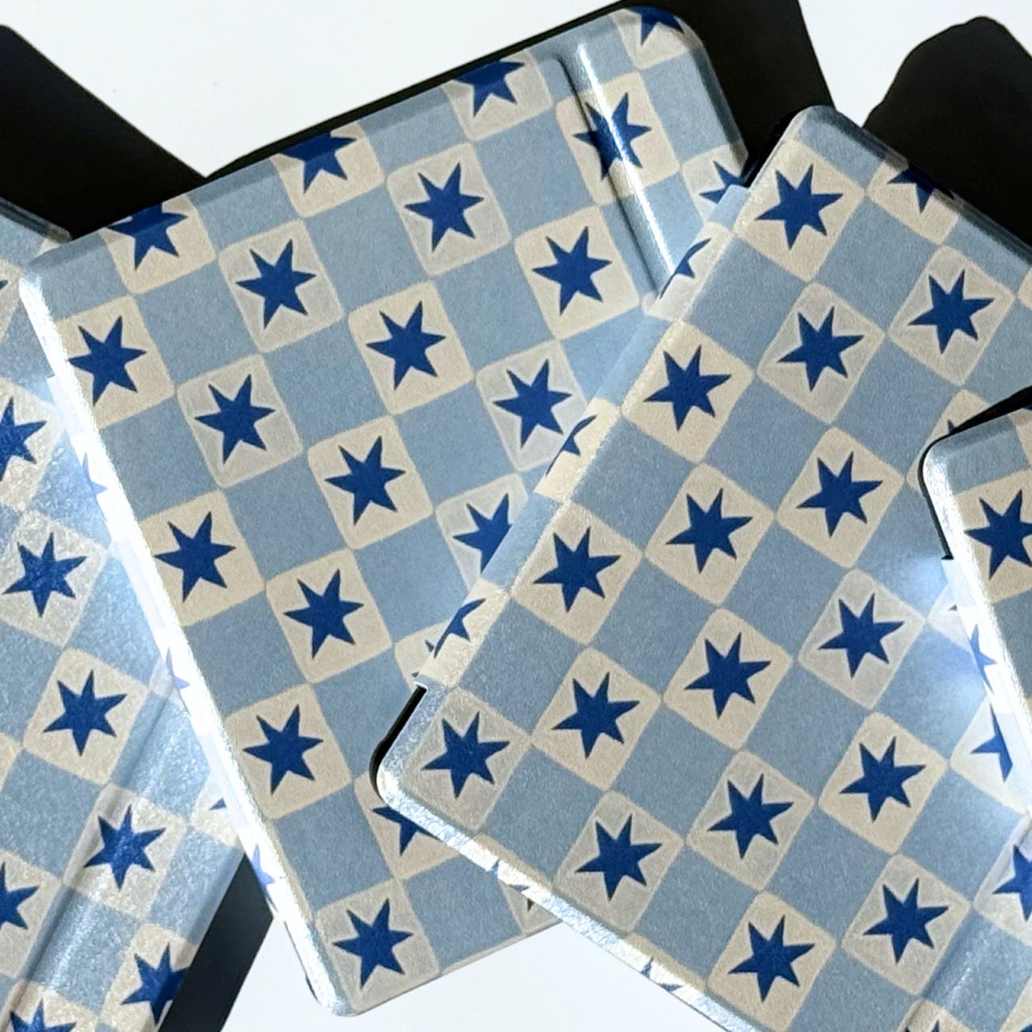 Blue star check Kobo Libra cases stacked on their sides