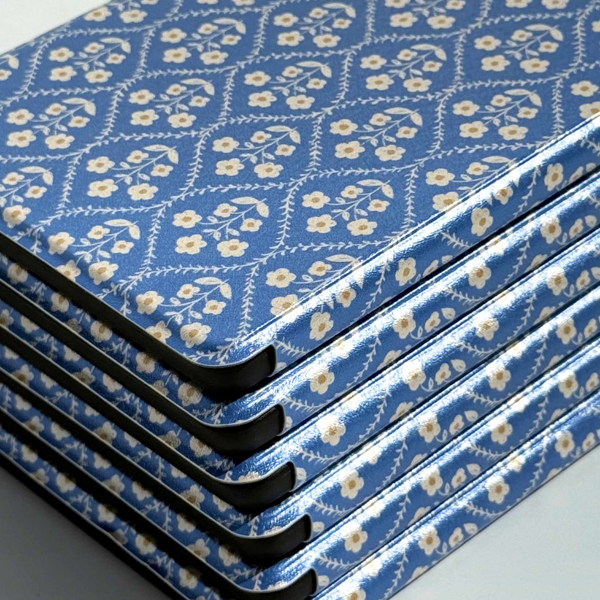 Detail of the blue floral spine on a Bluebell Kobo case