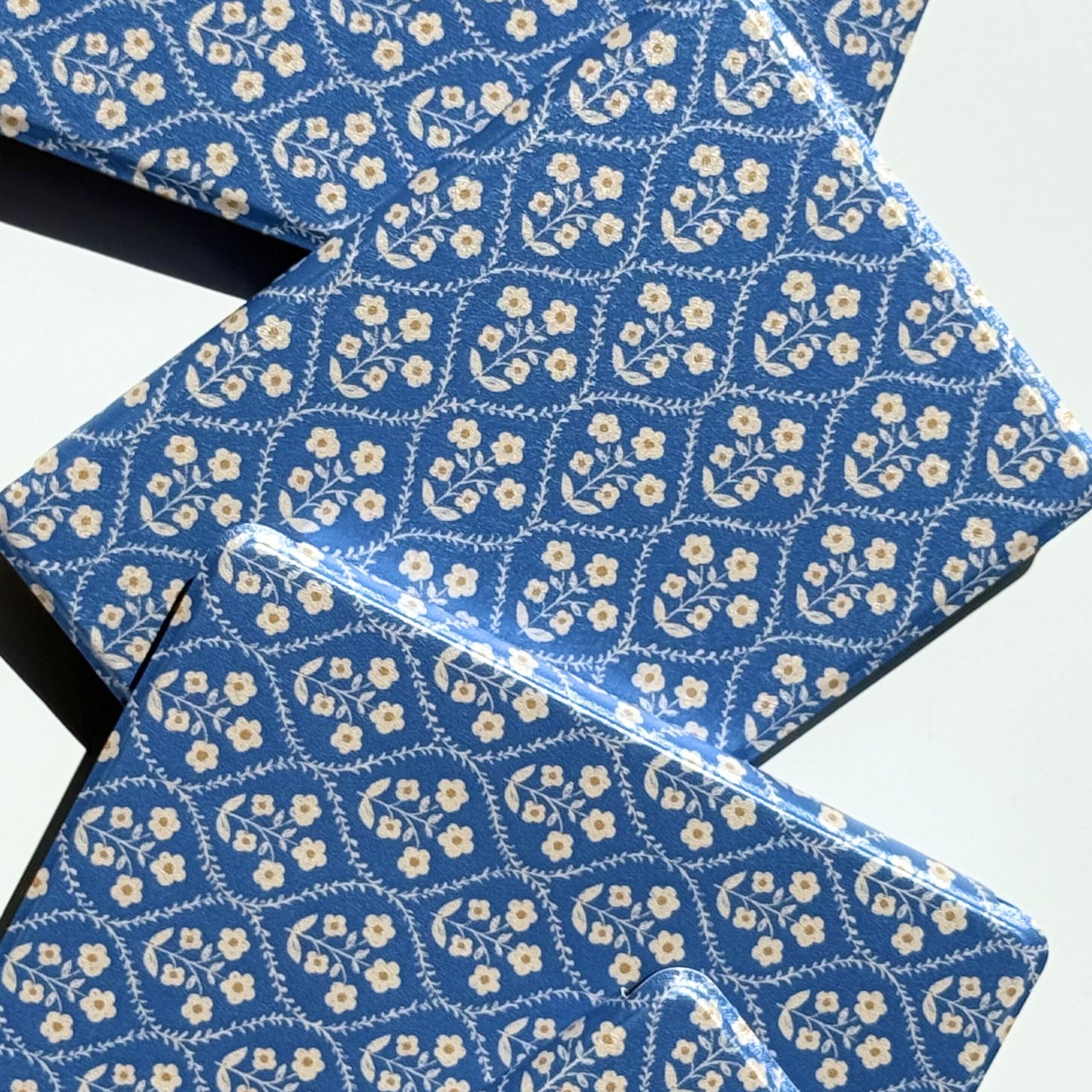 Bluebell Kindle case opened to show its blue and cream floral pattern — aesthetic floral Kindle cover by Case Society