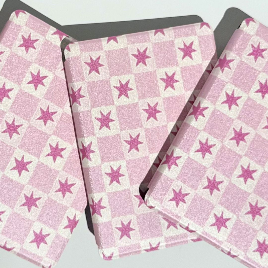 Front view of stacked pink star Blush Cosmos Kindle cases — premium aesthetic Australian Kindle case