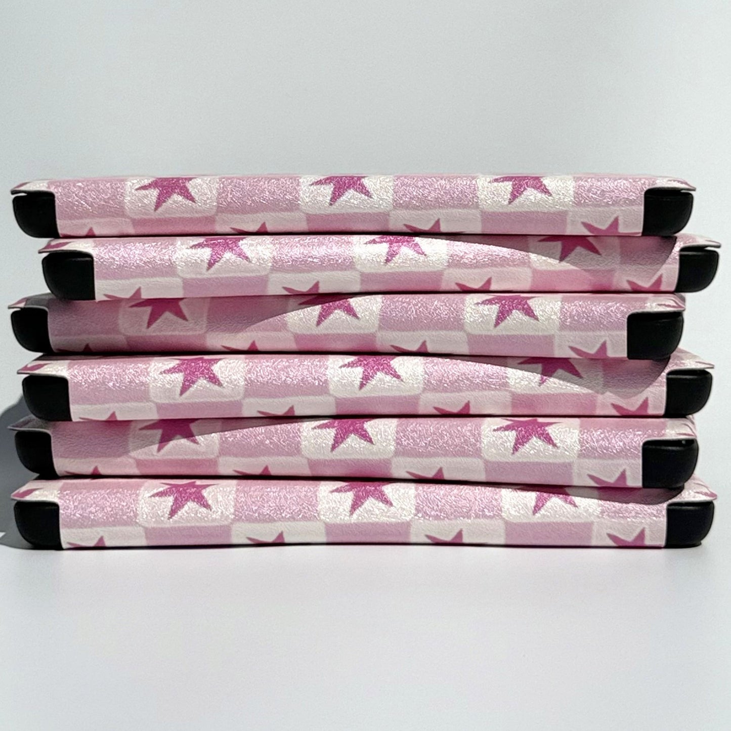 Pink star check Kobo Clara cases stacked on their sides, shipped from Australia