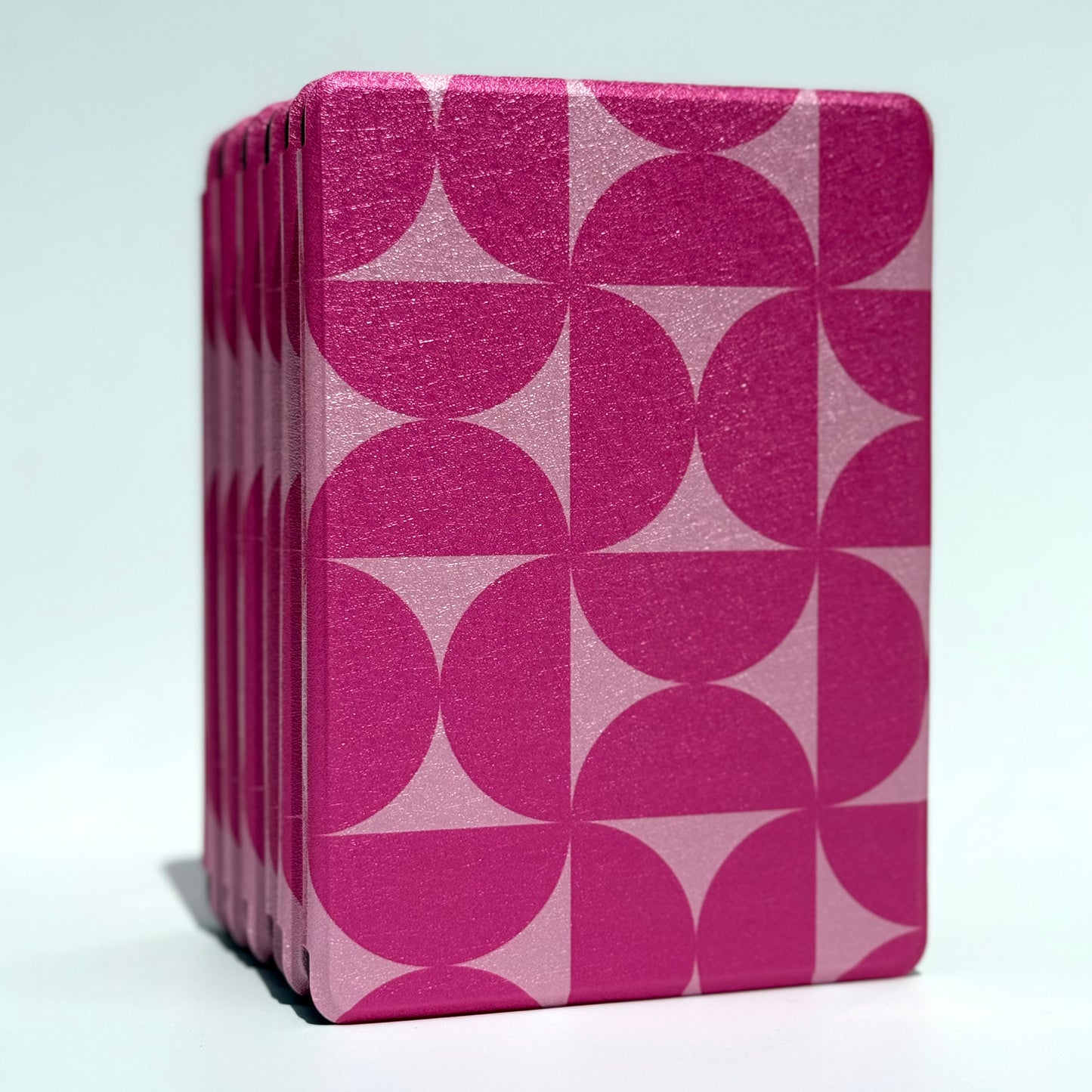 Blushing Moon Kindle Case front view of standing stack of pink geometric cases