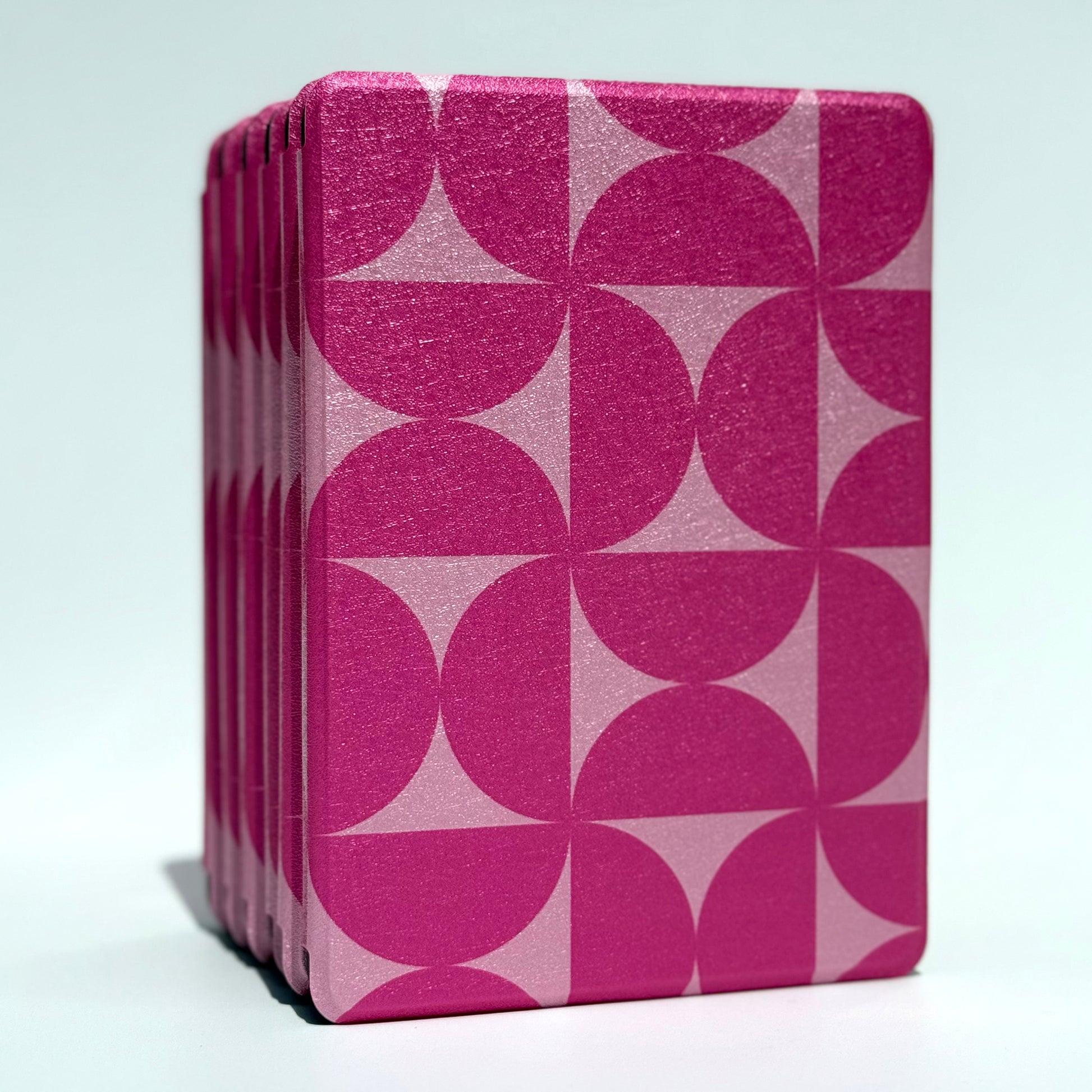Blushing Moon Kindle Case front view of standing stack of pink geometric cases
