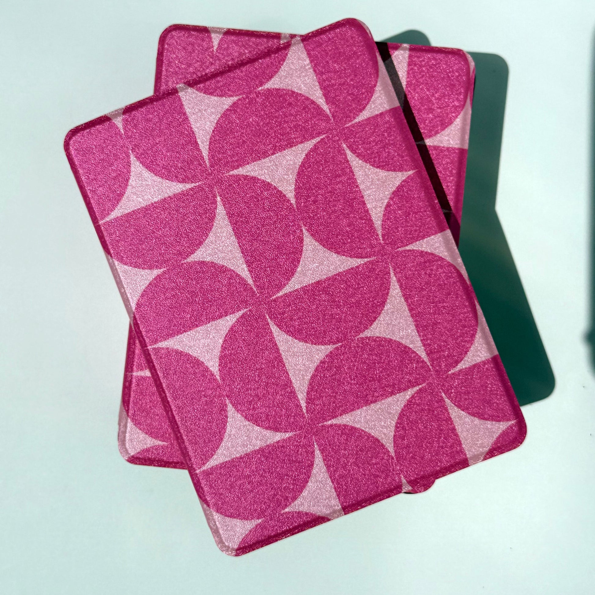 Blushing Moon Kindle Case front view from top of pink geometric printed cases
