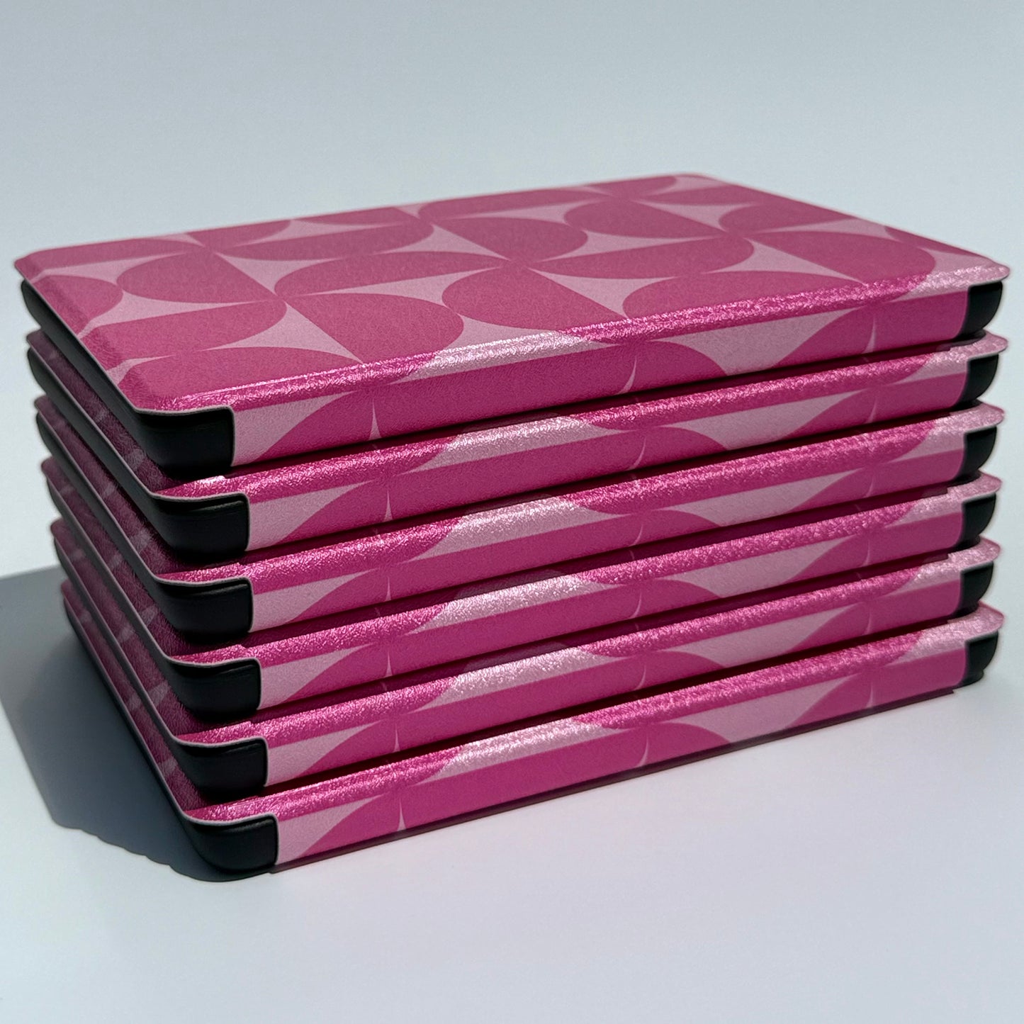 Blushing Moon Kindle Case stack of cases - side view of spines 