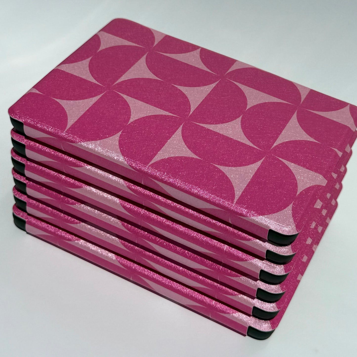 Blushing Moon Kindle Cases - stack of cases from top and spine angle