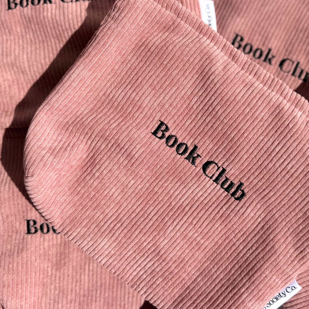 Close view of blush pink corduroy book pouches with Book Club stitching, shipped from our Australian shop